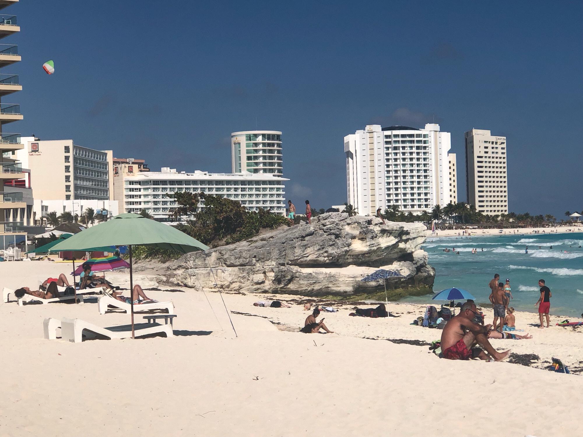 Miles proposed on the “cliff” (or rock depending on who’s telling the story) on the beach on January 31 in Cancun, Mexico.