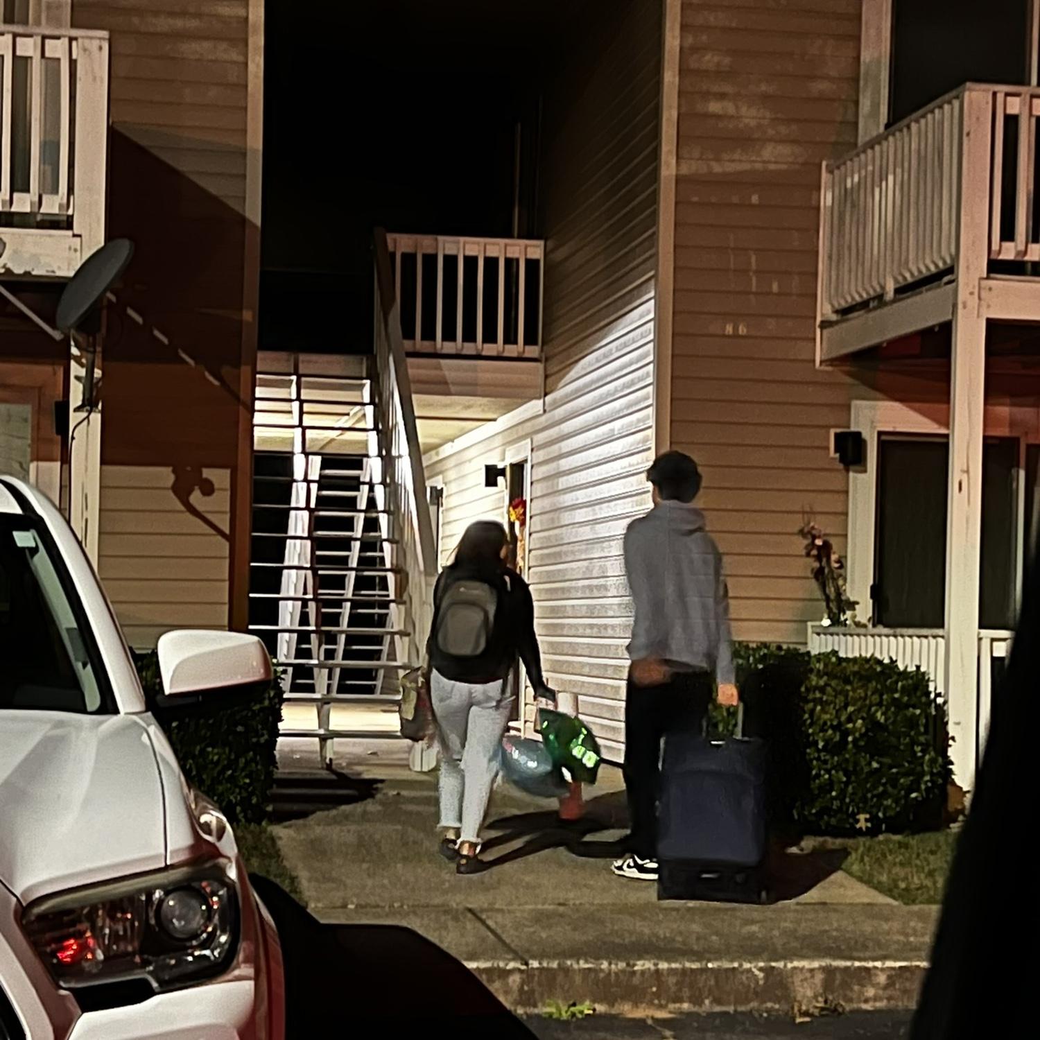 Walking up to their apartment for the first time together