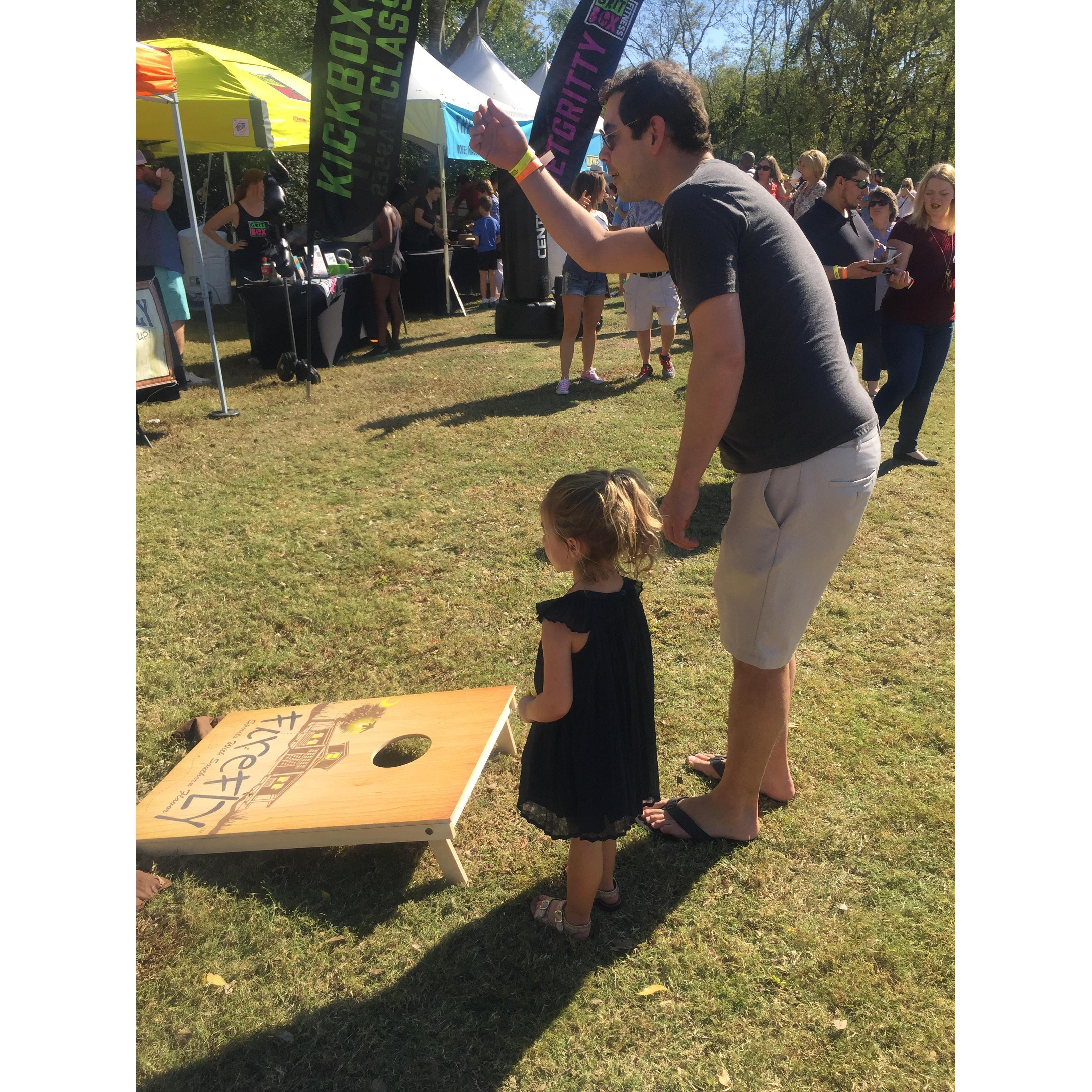 Andrew teaching Cullen to play Corn hole! SO CUTE