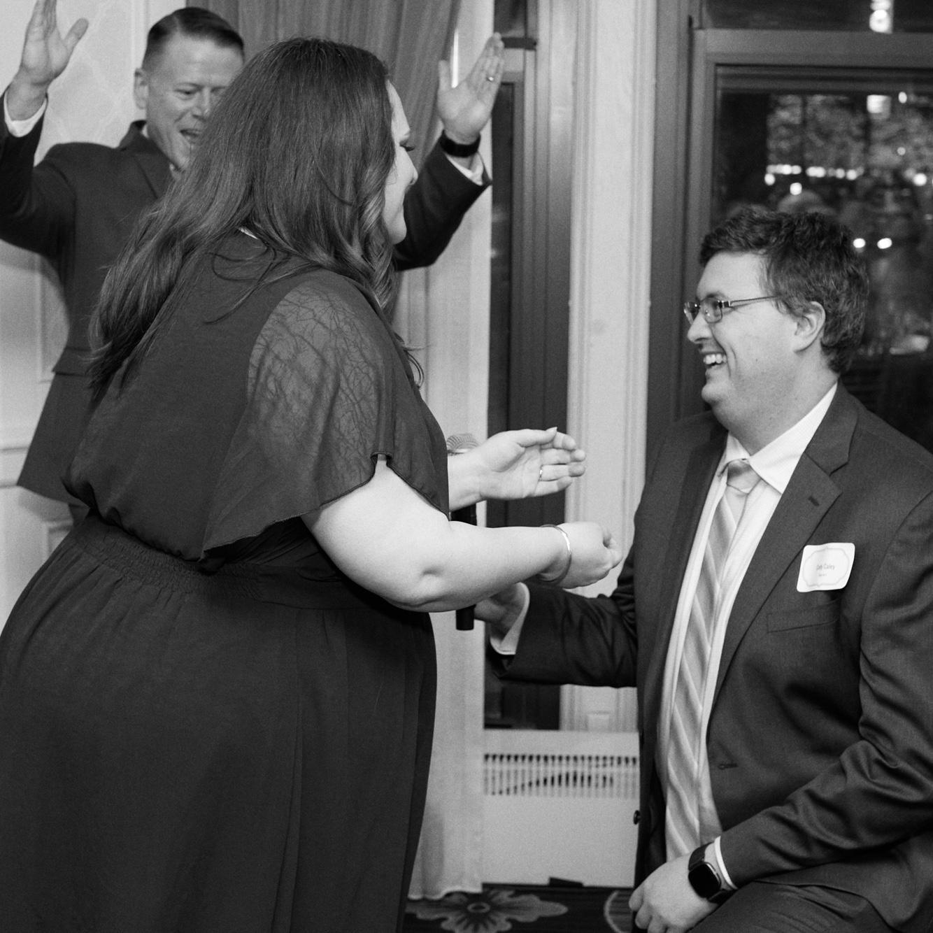 We got engaged privately at the Drake Hotel, but that night Lauren had a work Awards Banquet . The V.P. called Cody up for a reenactment in front of the company. He’s cheering in the background.