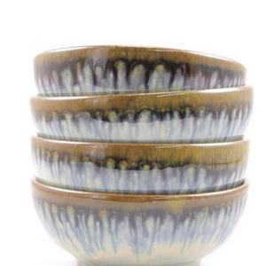 Four small bowls in light blue glaze
