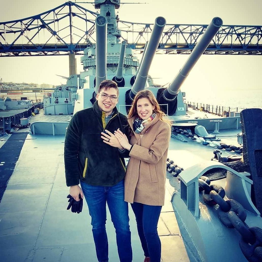 Kate proposes to Travis on the deck of the USS Massachusetts