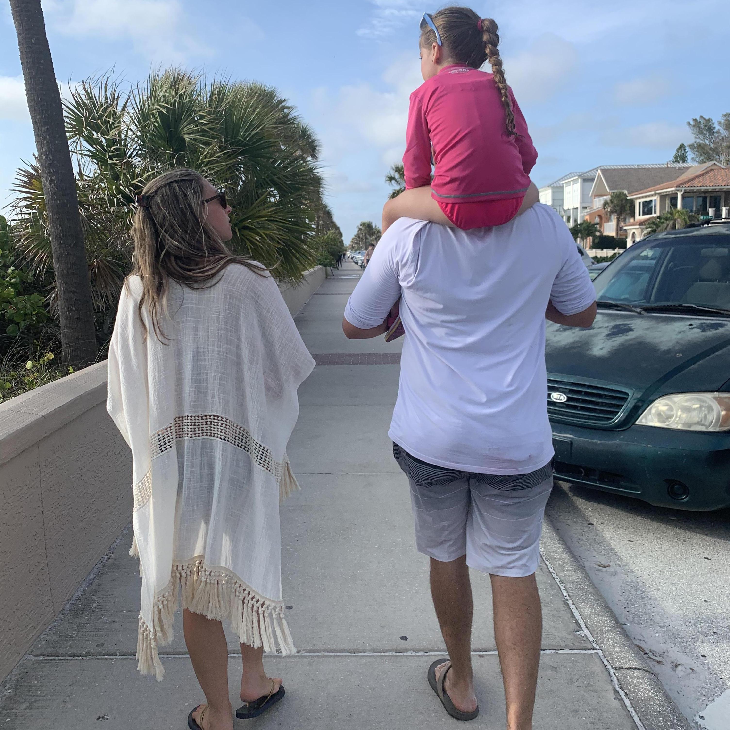 A photo of our family enjoying Pass-a-grille Beach!