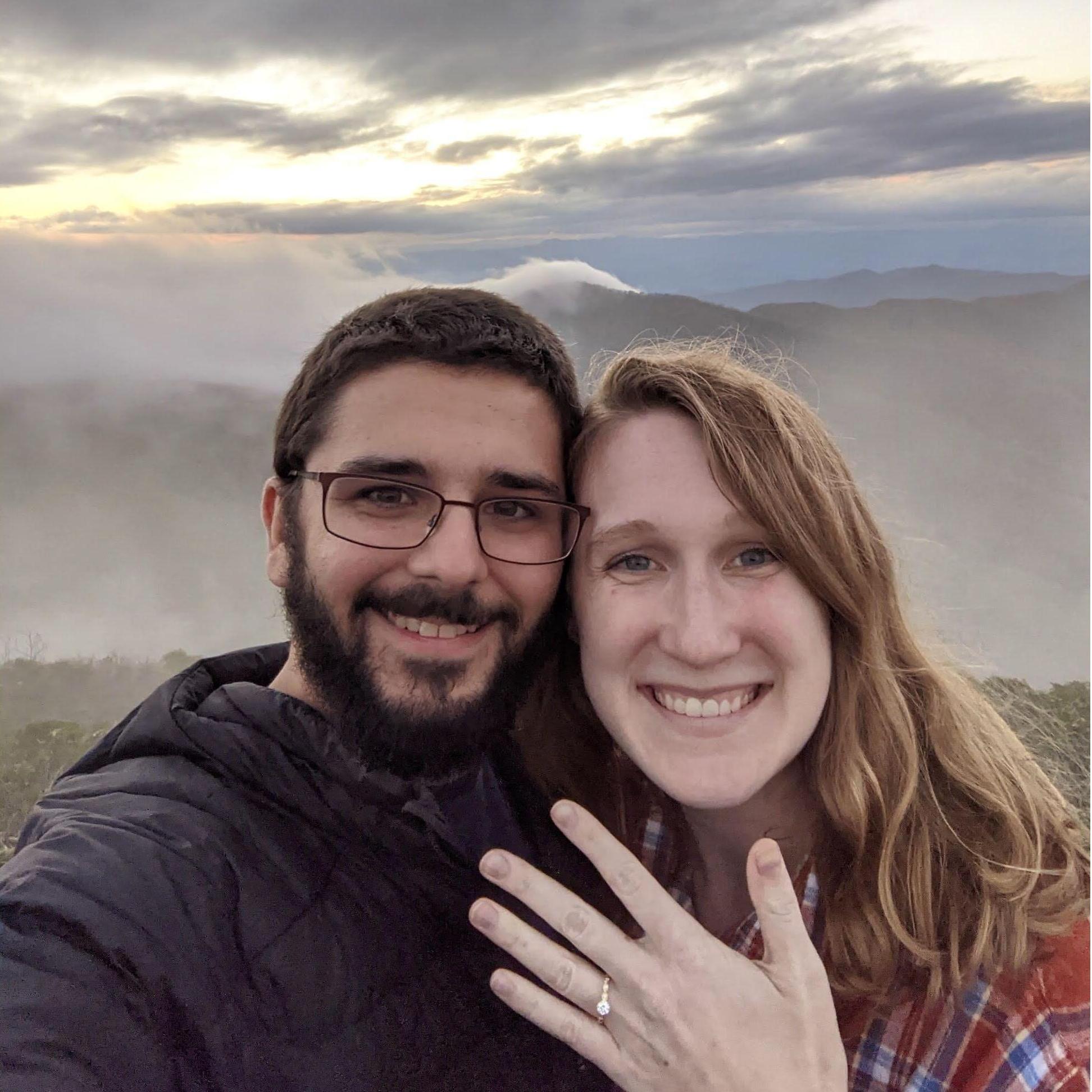 Jacob proposes after watching the sunset at the top of Craggy Pinnacle on the Blue Ridge Parkway!