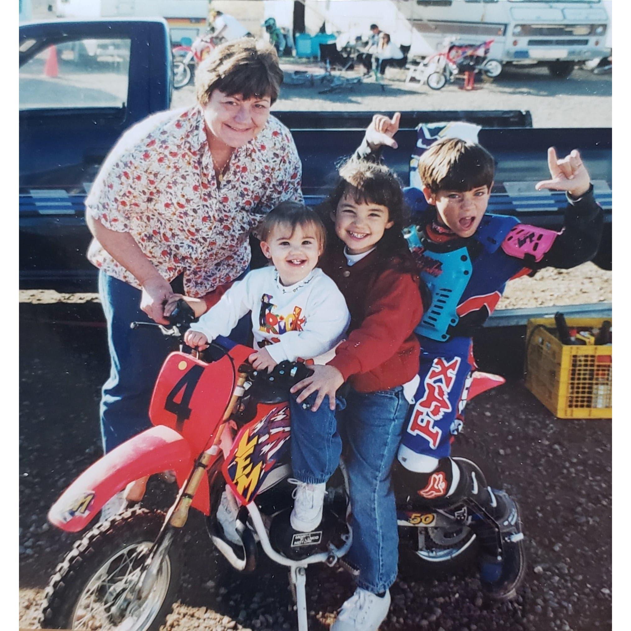 Keith at a motocross race, with fans Grandma Myra, sister Erika, and sister Rachel.