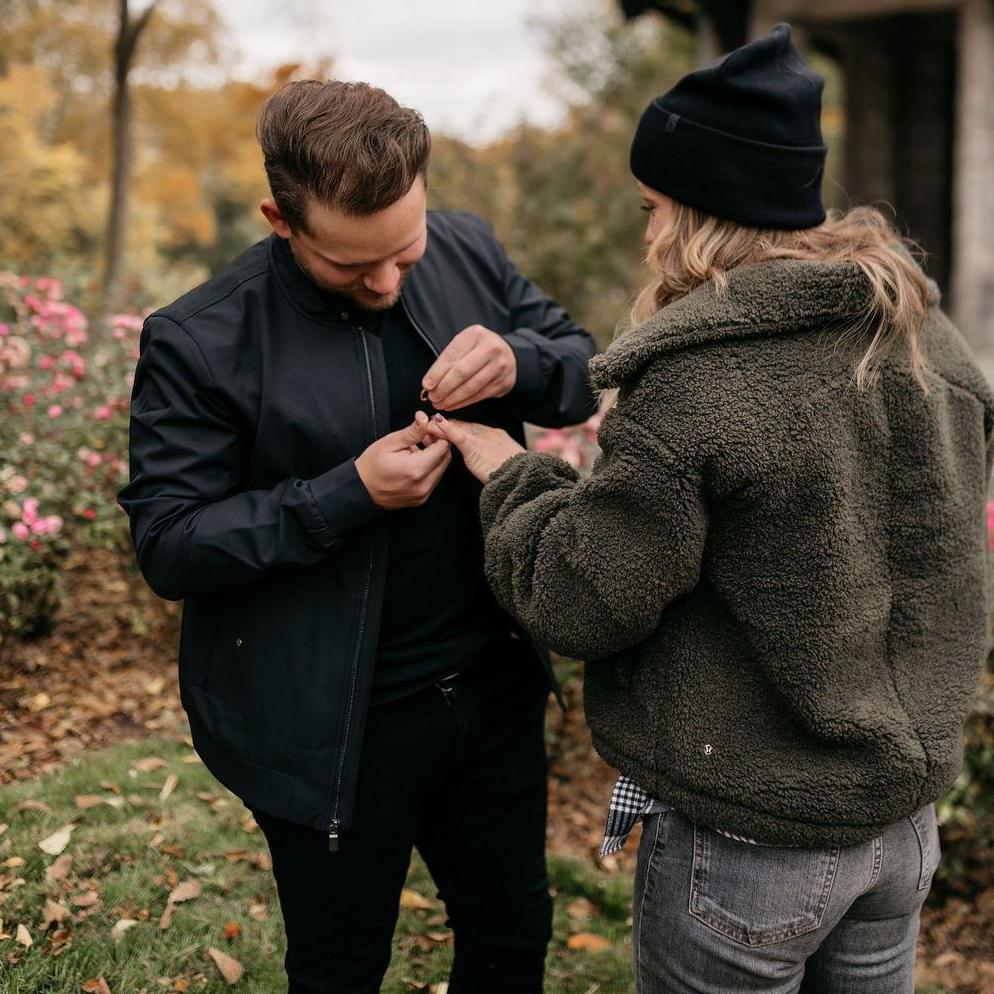 Putting the ring on Corynn after she said yes!
