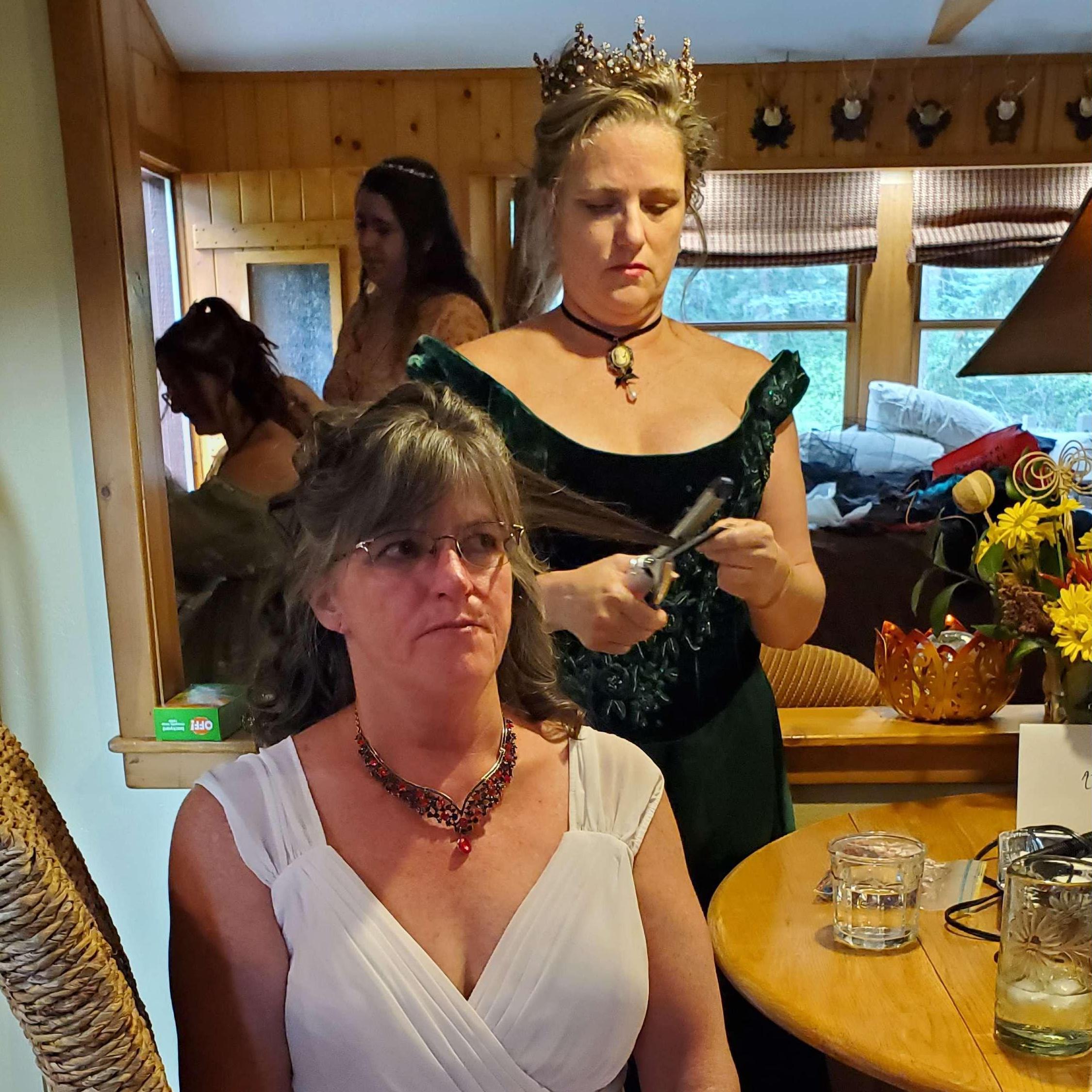 Debbi doing her best to make my hair look good.