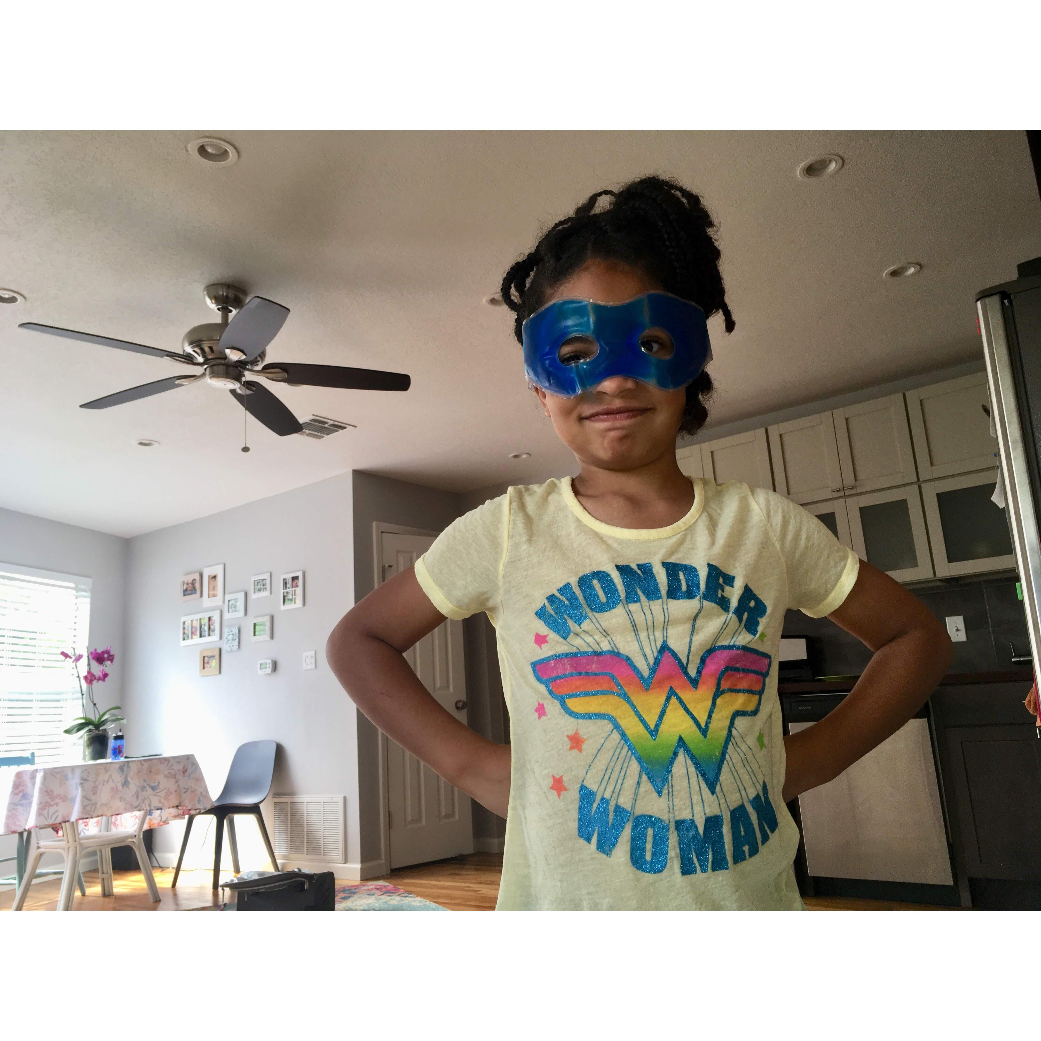 The apple didn't fall too far from the tree. Wonder Woman wears a beauty mask. (San Antonio, July 2019)