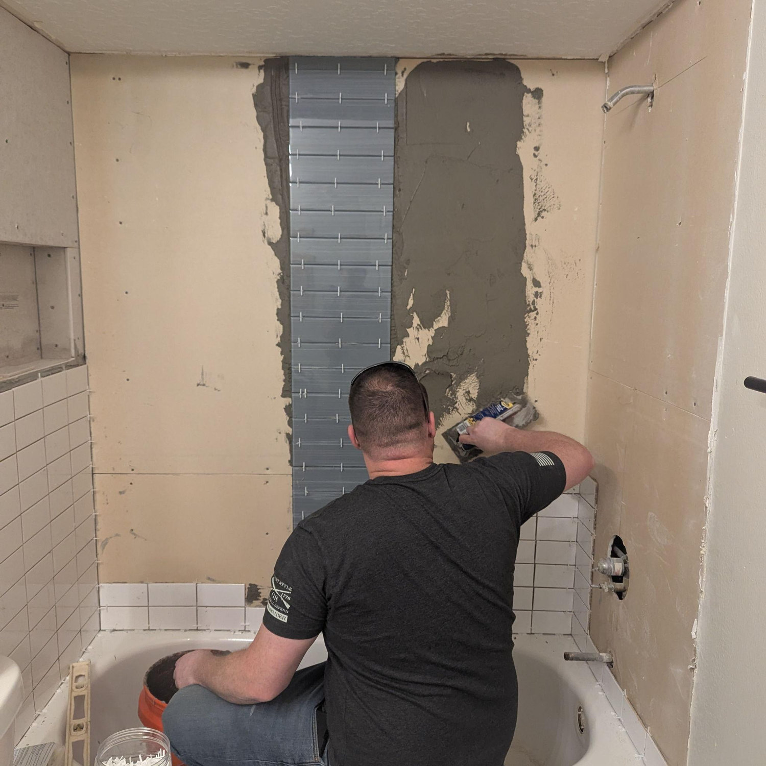 His first time tiling...I don't think he'd do it again