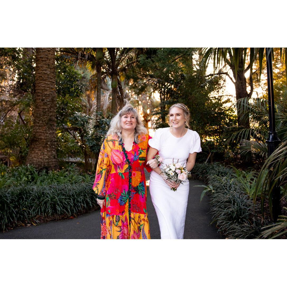 Tabitha and her mom walking towards the alter in NZ