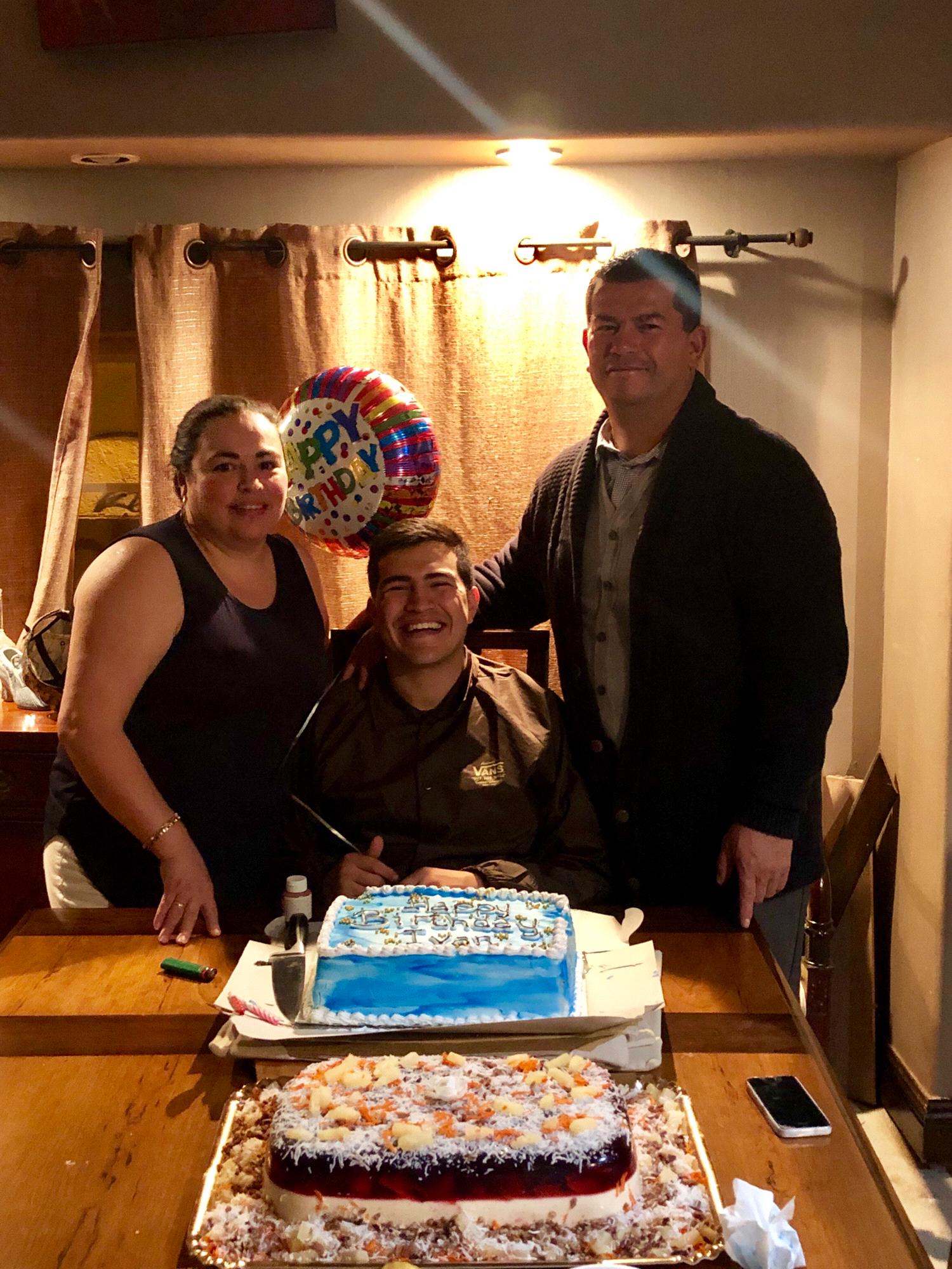Ivan with mom and dad on his birthday.