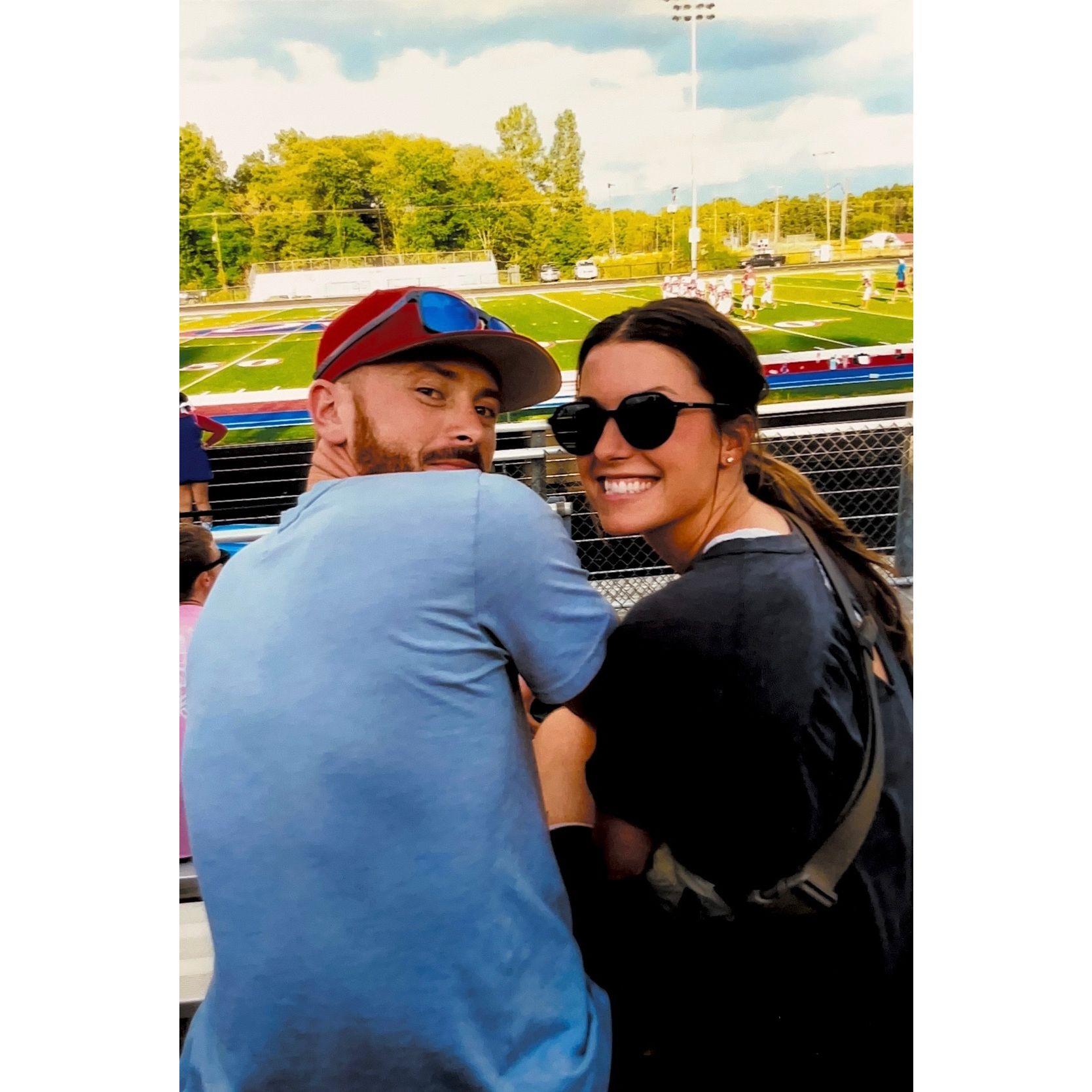 Our favorite compromise... Daniel watches football - Lucy gets a snack from the concession stand