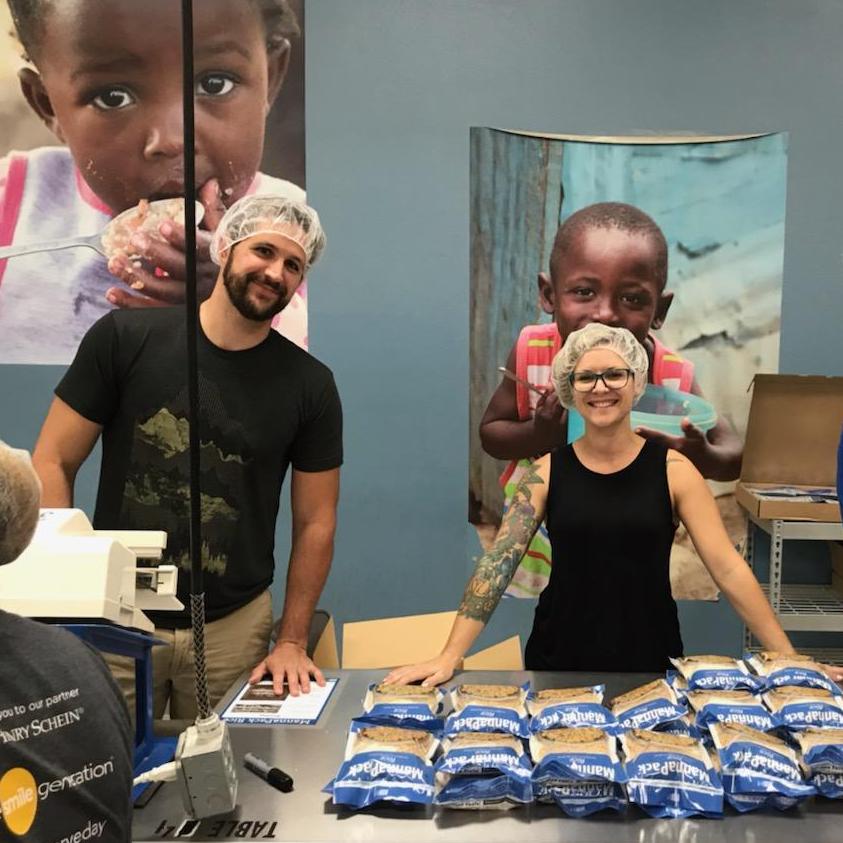 Volunteering together at Feed My Starving Children (FMSC) in Mesa, AZ