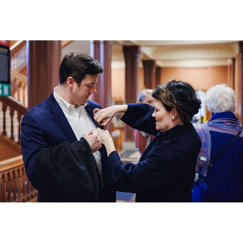 Michael's sister Kerry helping with his boutonniere.