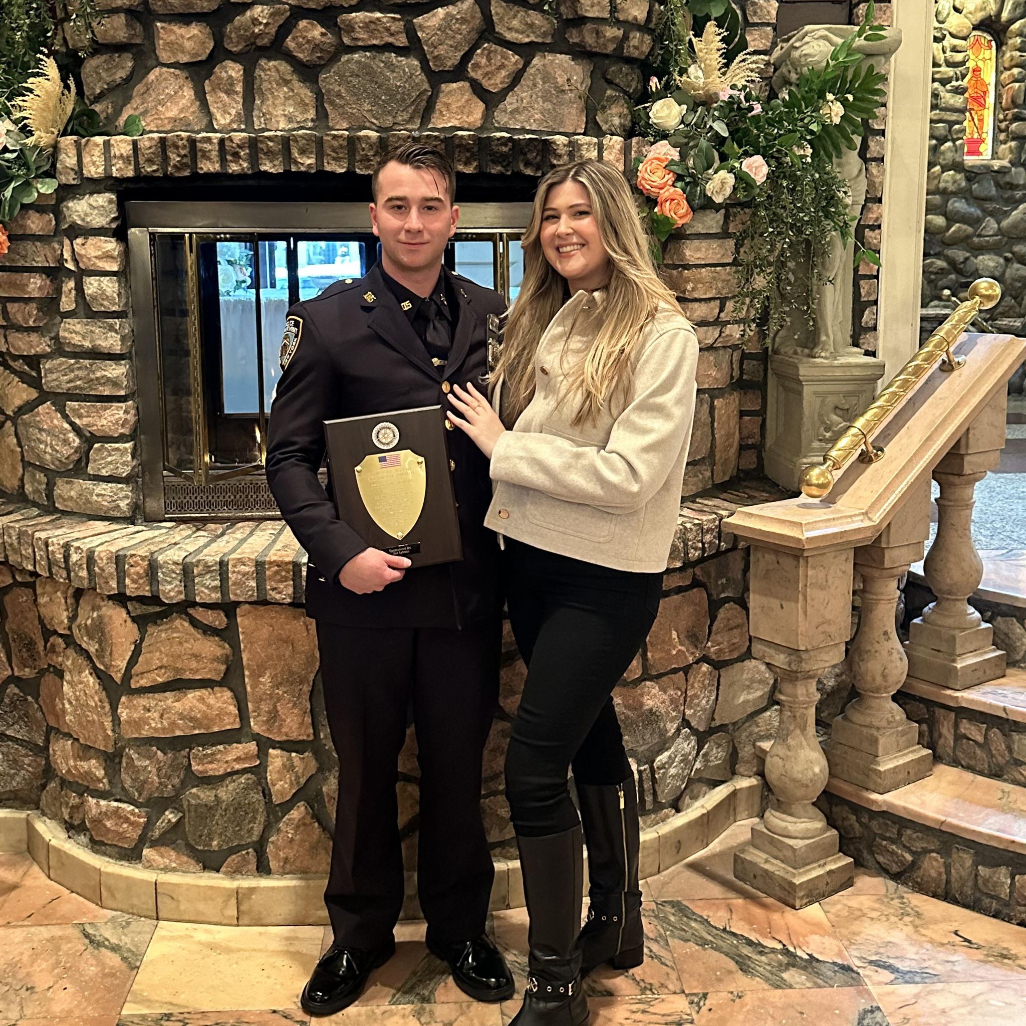 A dinner celebration in honor of Ethan receiving an award from the NYPD.