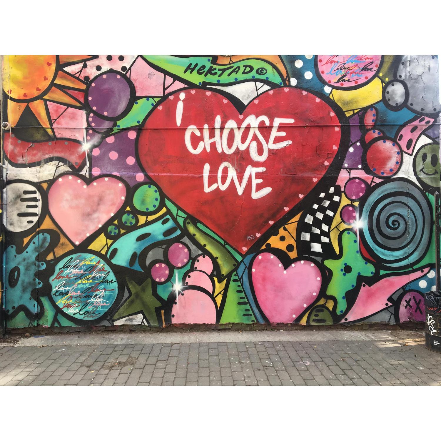 Derek planned to propose at a restaurant, but while scouting he discovered this graffiti mural and went with this location.  The art work is by the artist Hektad, now we notice his work around NYC.