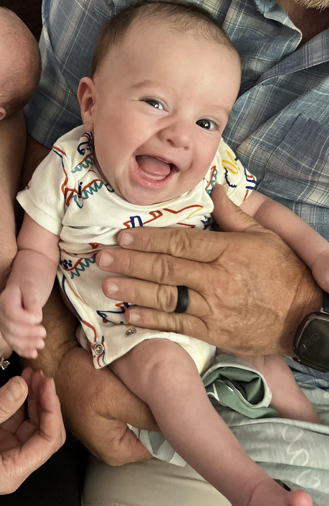 Our smiling baby Isaac at two months old