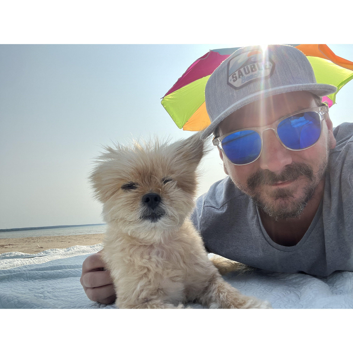 Gizmo and Brad enjoying a beach day