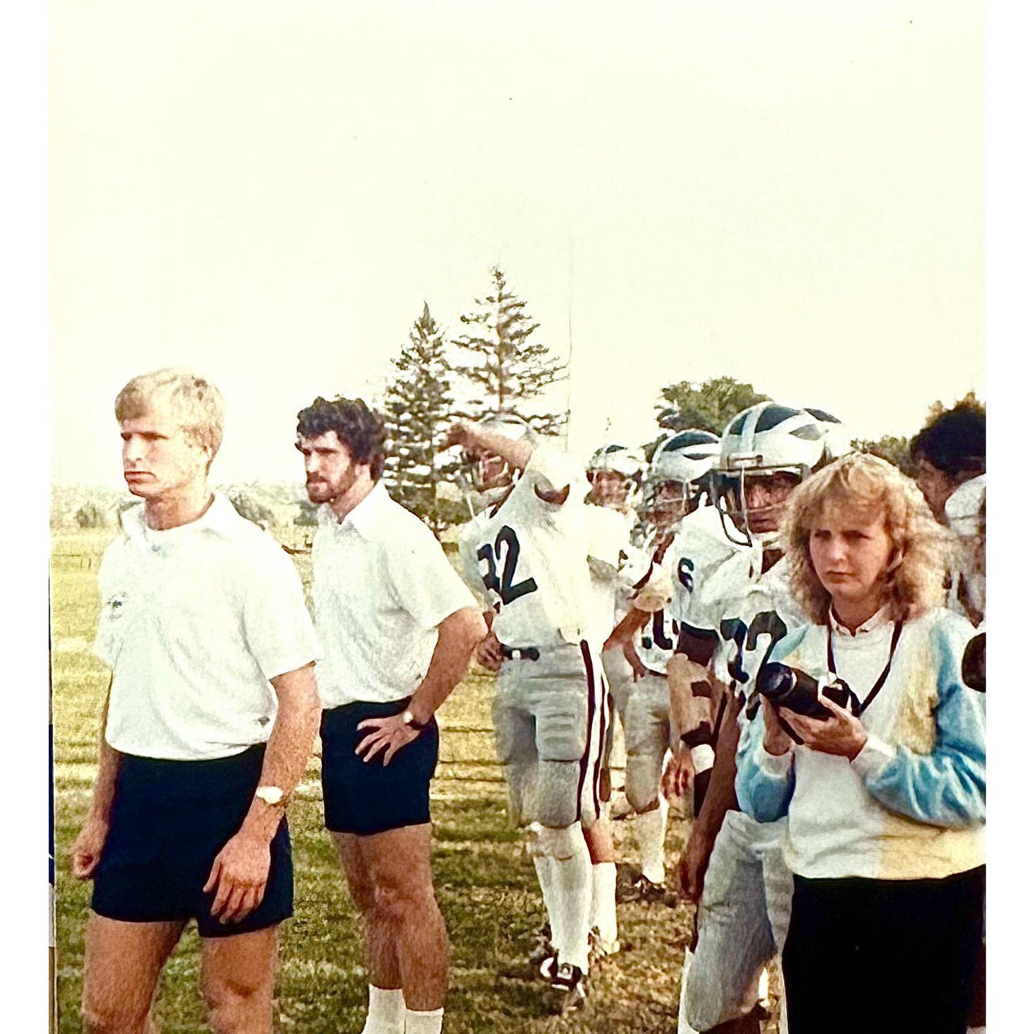 #82 in the middle looking at the action on the gridiron.