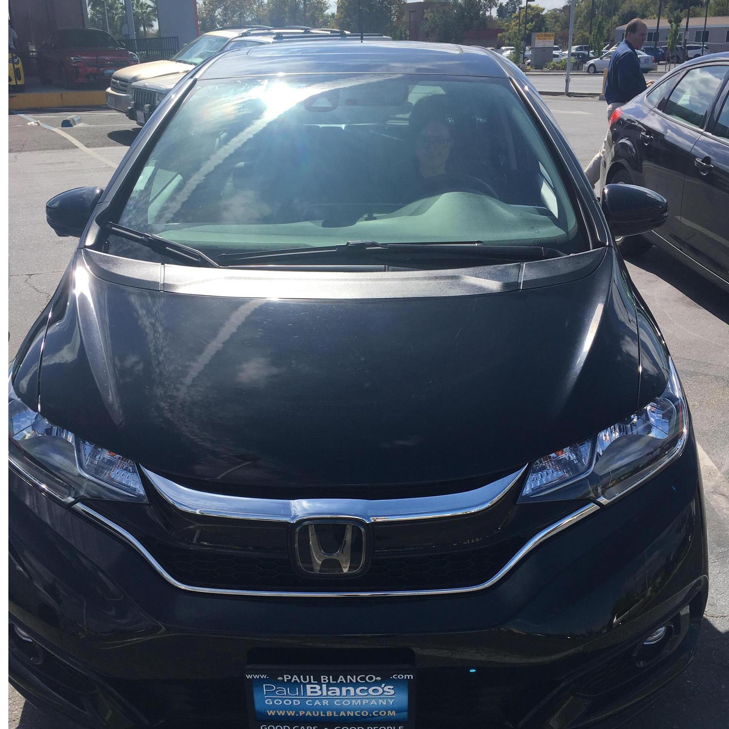 There was a half baked plan to propose by secretly buying a car, but that proved unrealistic. Us driving the new car off the lot.