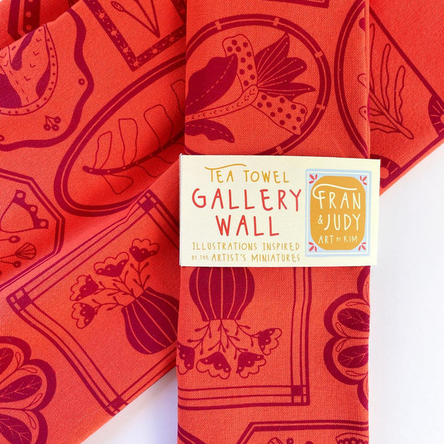 Tea Towel screen printed with flower illustrations orange towel with burgundy ink