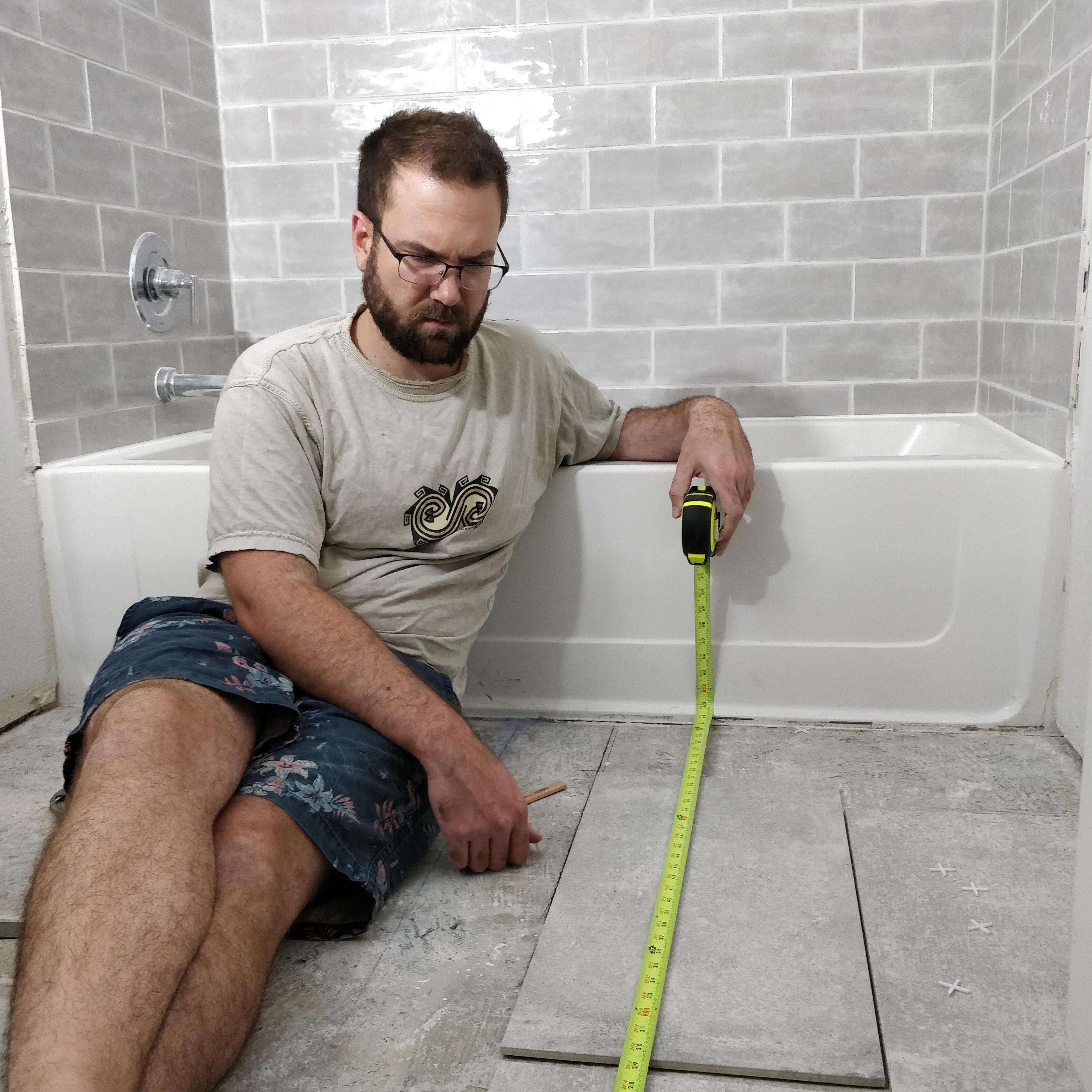 We do lots of projects together. This is a shot of Adam doing math during a bathroom remodel