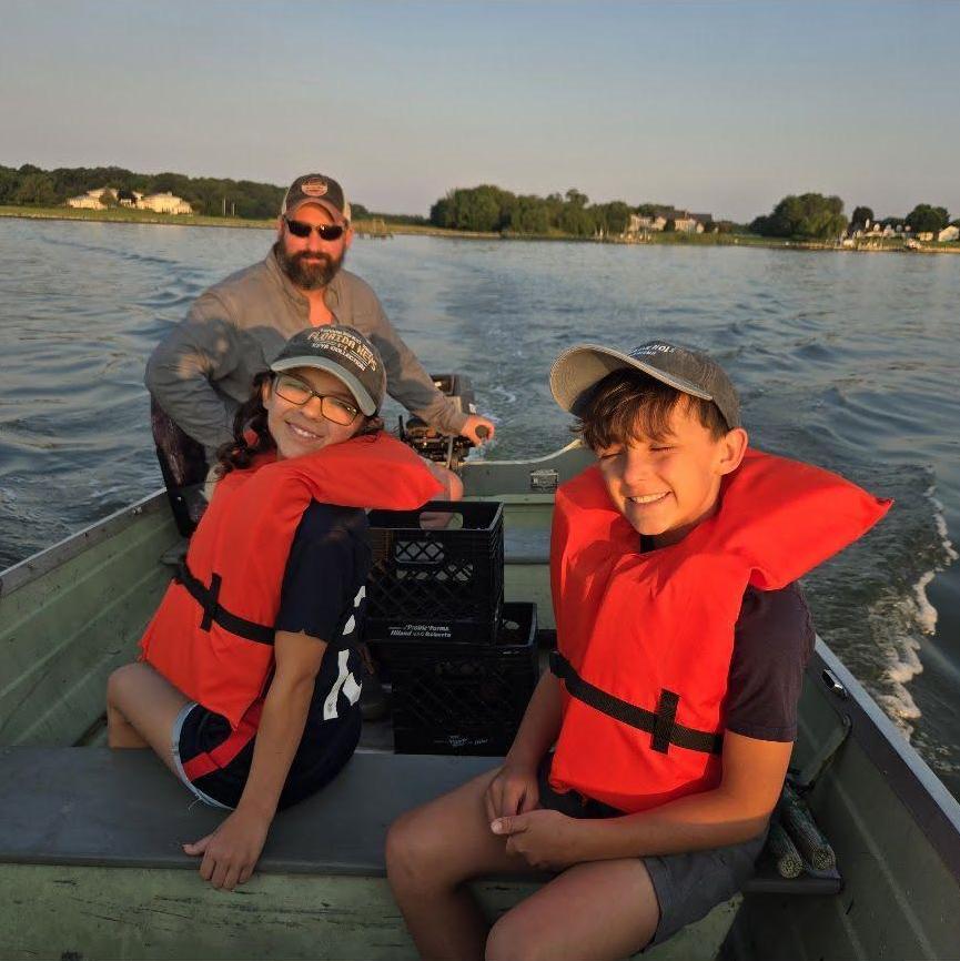 Everly and Gavin crabbing with Bryan on July 4th, 2025