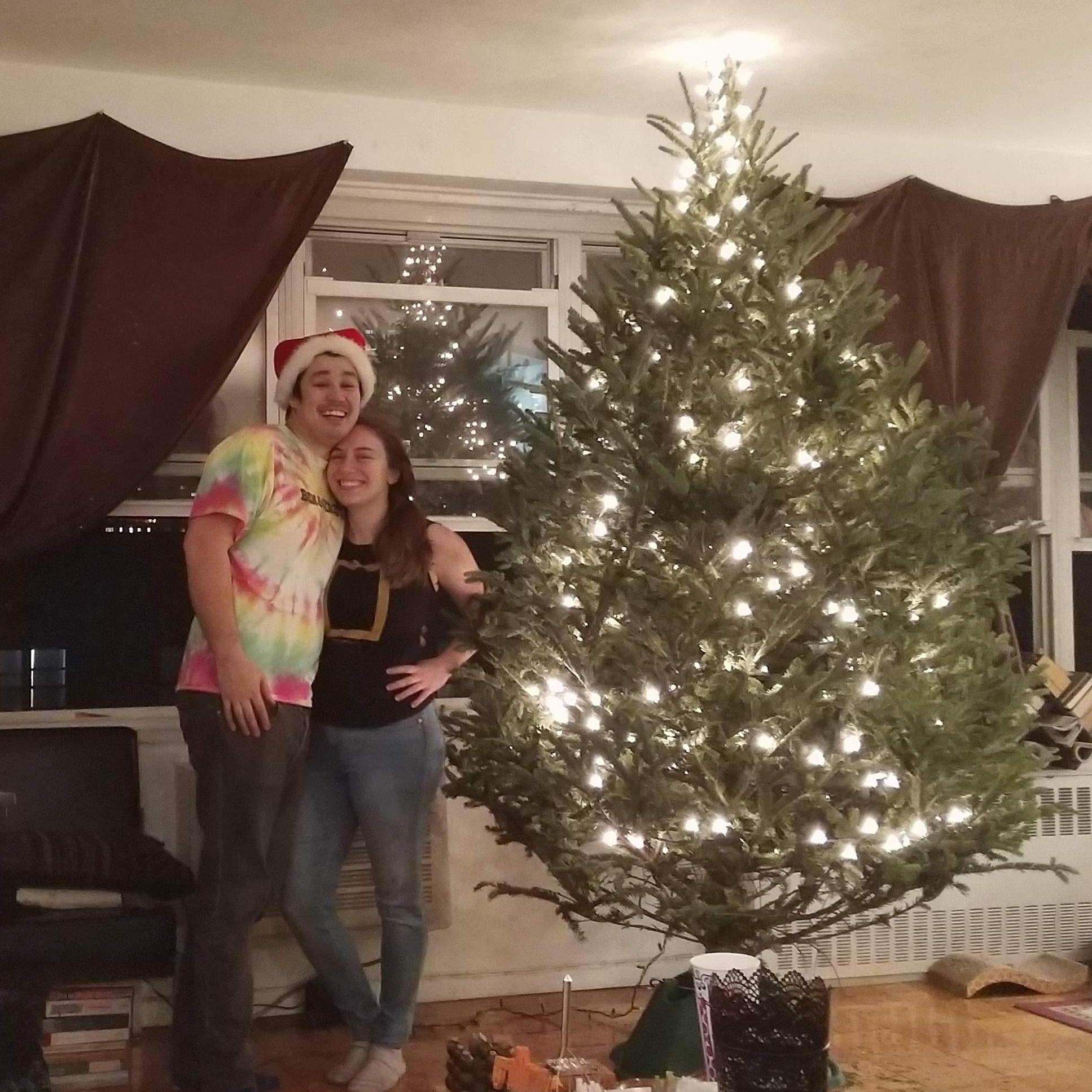 With our very first Christmas tree together, which Jared gets full credit for maneuvering into our apartment.