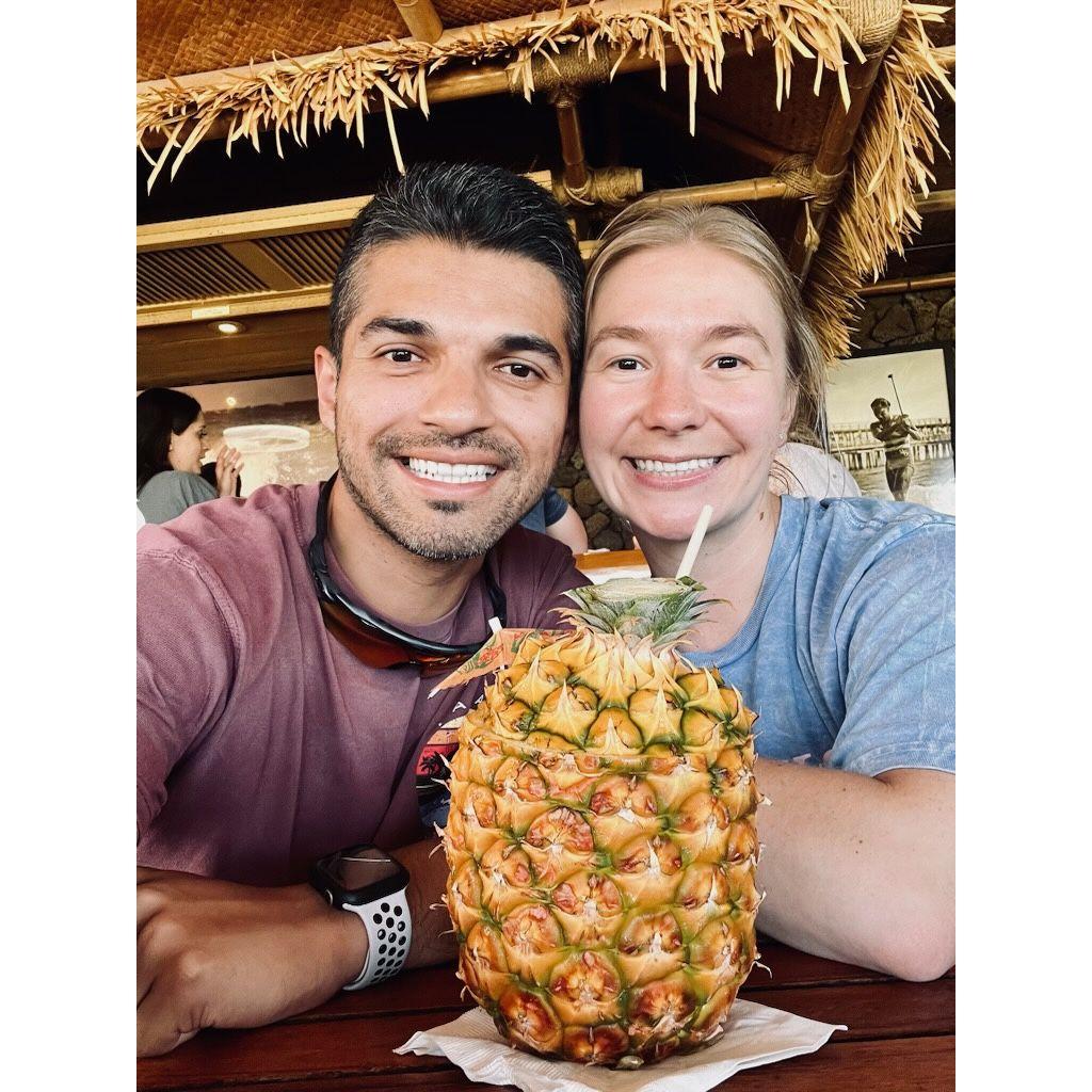 Big smiles for a delicious drink in a pineapple