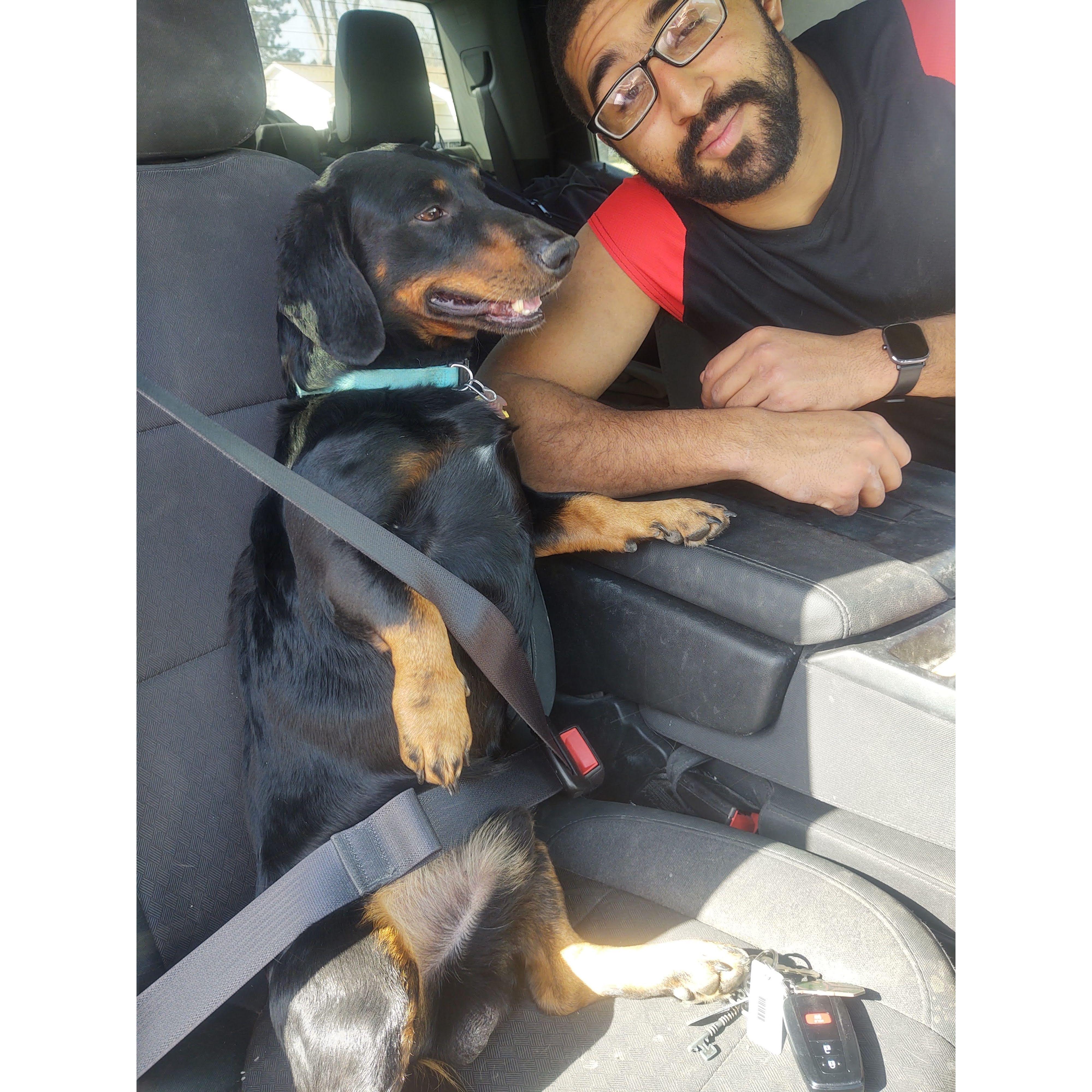 RJ strapping in his first born son for a ride.