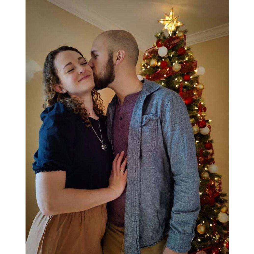 Our fourth Thanksgiving together (posing in front of a very early Christmas tree)