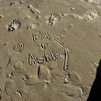 Ed wrote our names in the sand while we were walking along the beach.