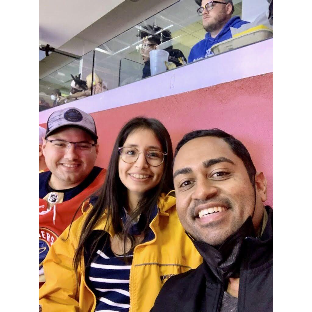 Devin, Leny, and Shiva - our friend that introduced us attending a hockey game in January 2022. Kodak Black the rapper can be observed in the photo as well.