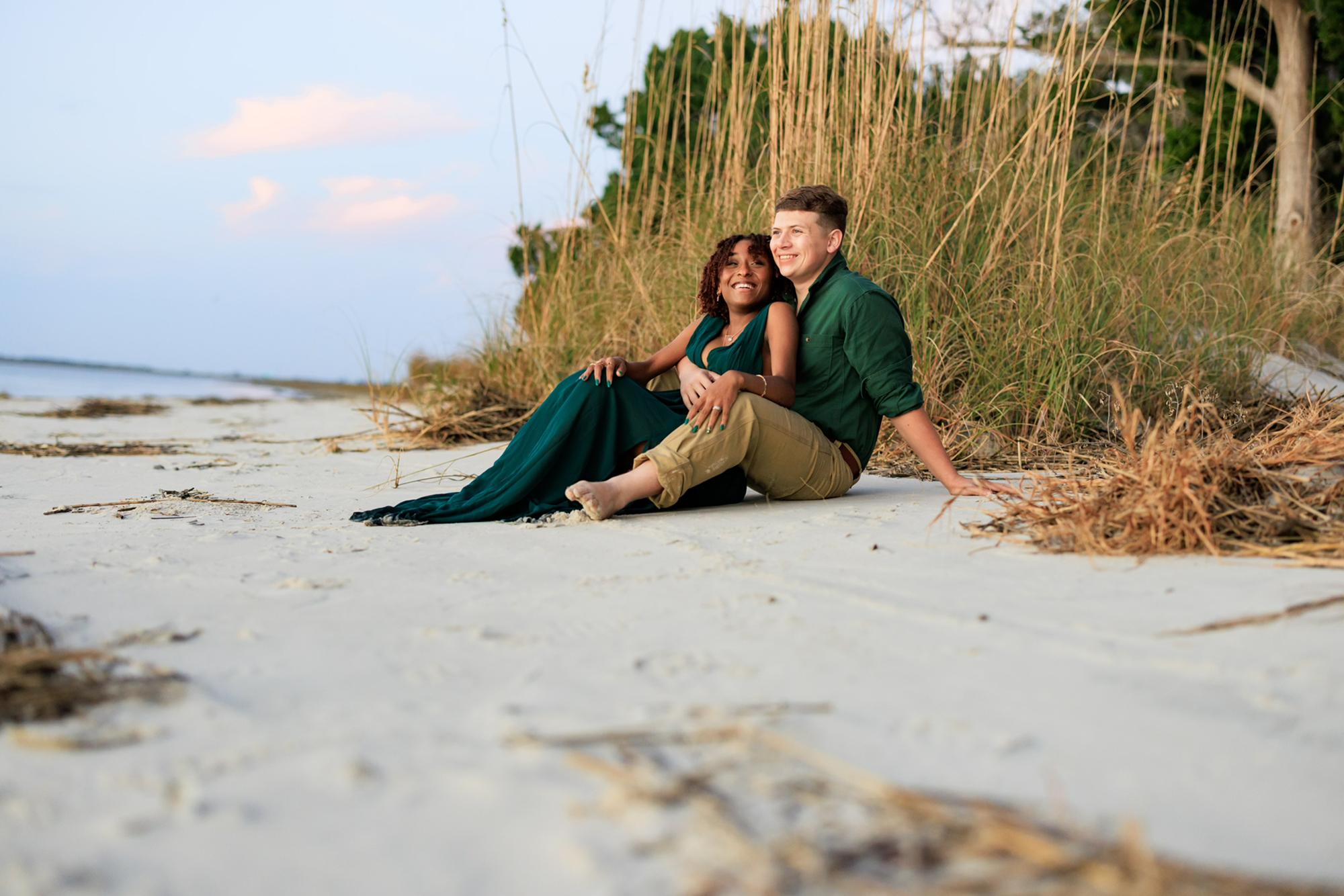 I hate sand and you may can't tell, but sitting in it was so uncomfortable for me. Chris knows this and thinks it's funny, lol.