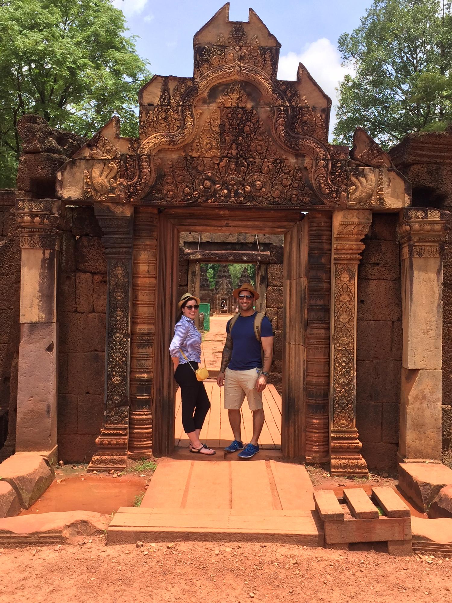 Hiding in the smallest bit of shade at the “Pink temple”, Banteay Srei is one of the most elaborate temples at Angkor, Cambodia!