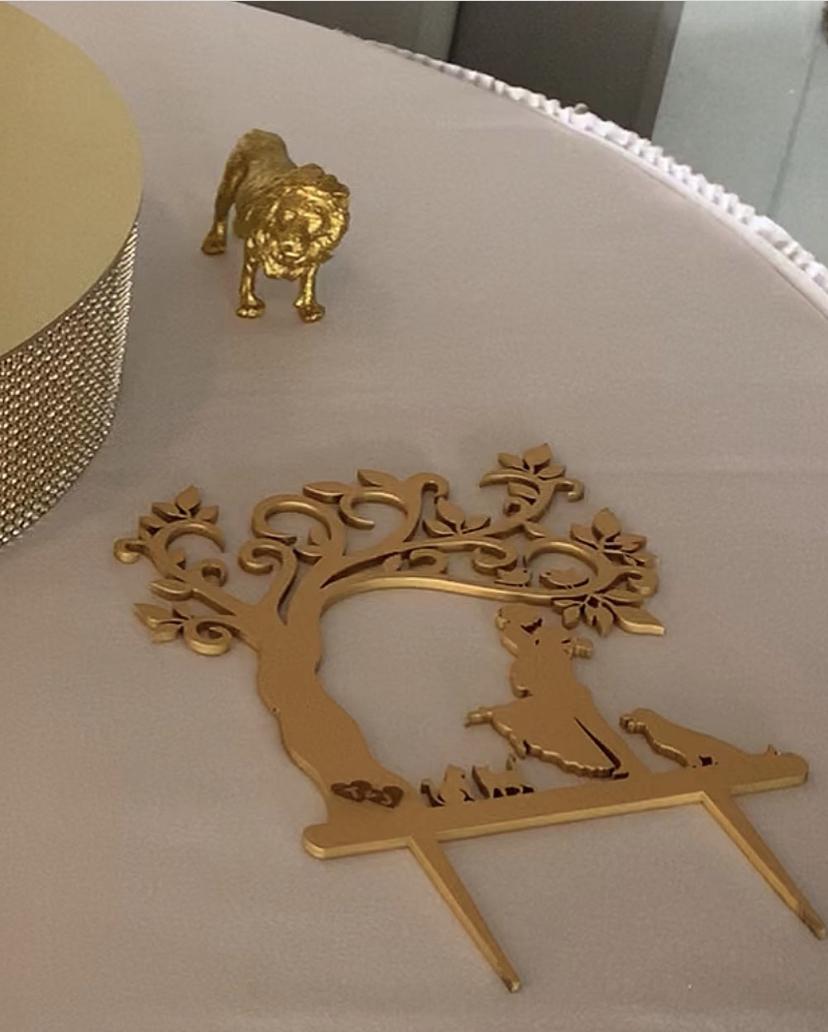 Customized gold cake topper featuring John, Tara and our beloved babies!