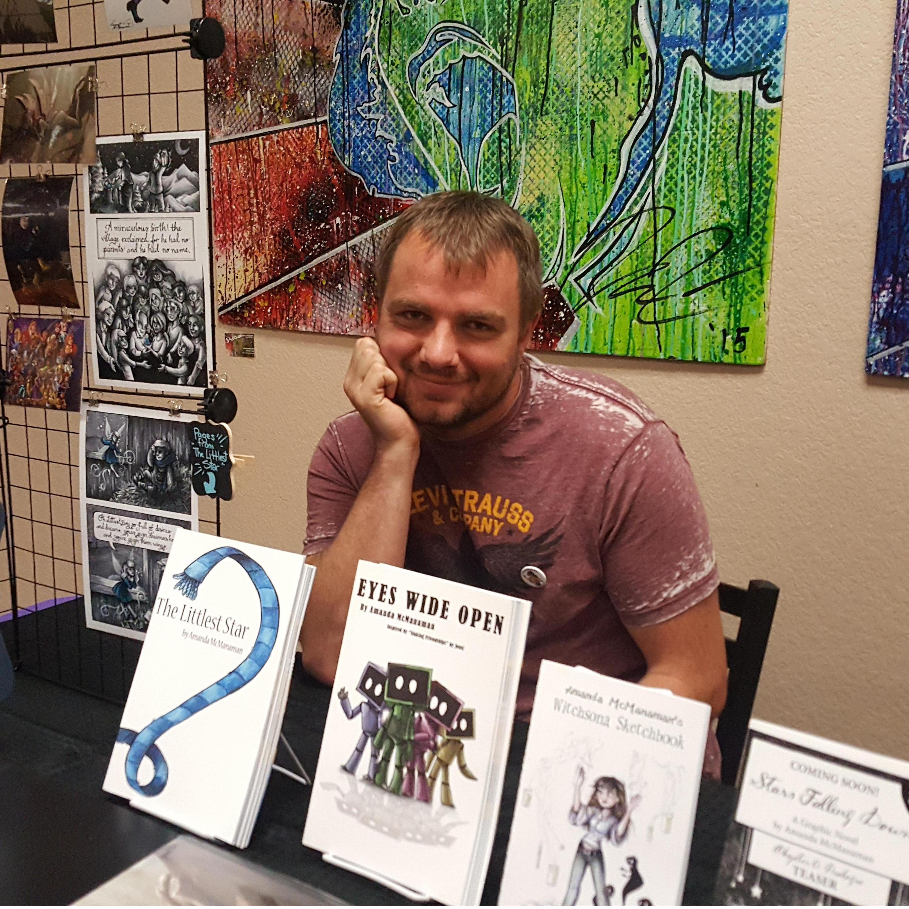 Cody helping out Amanda's comic book table!