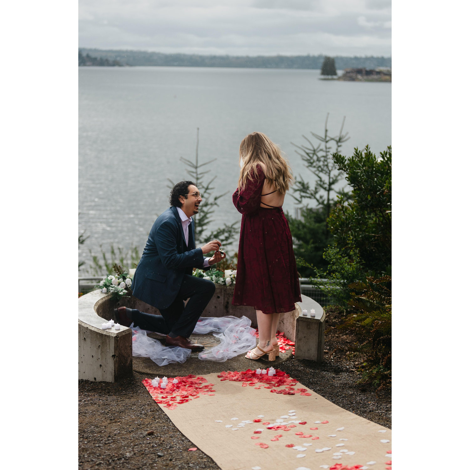 What was supposed to be family photos turned out to be the best surprise proposal ever! Kylie's parents even hid behind a bush to surprise her.
