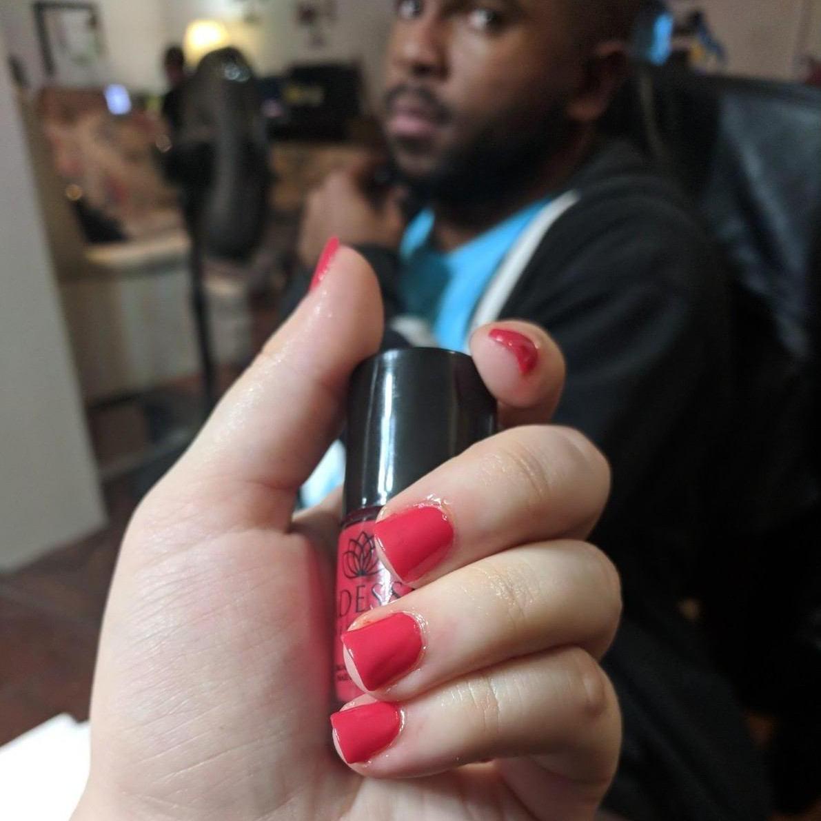 This is after... Look at how good he did! He even put cuticle oil on and everything! For those of you who don't know... Teleia is a nail artist and has been painting nails of friends and family for various occasions since she was 12.