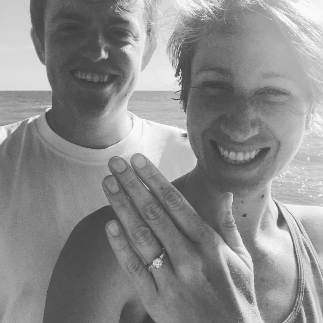 The awkward "we're engaged" selfie where we are both still kind of in shock. Lake Michigan in Chicago July 8, 2017