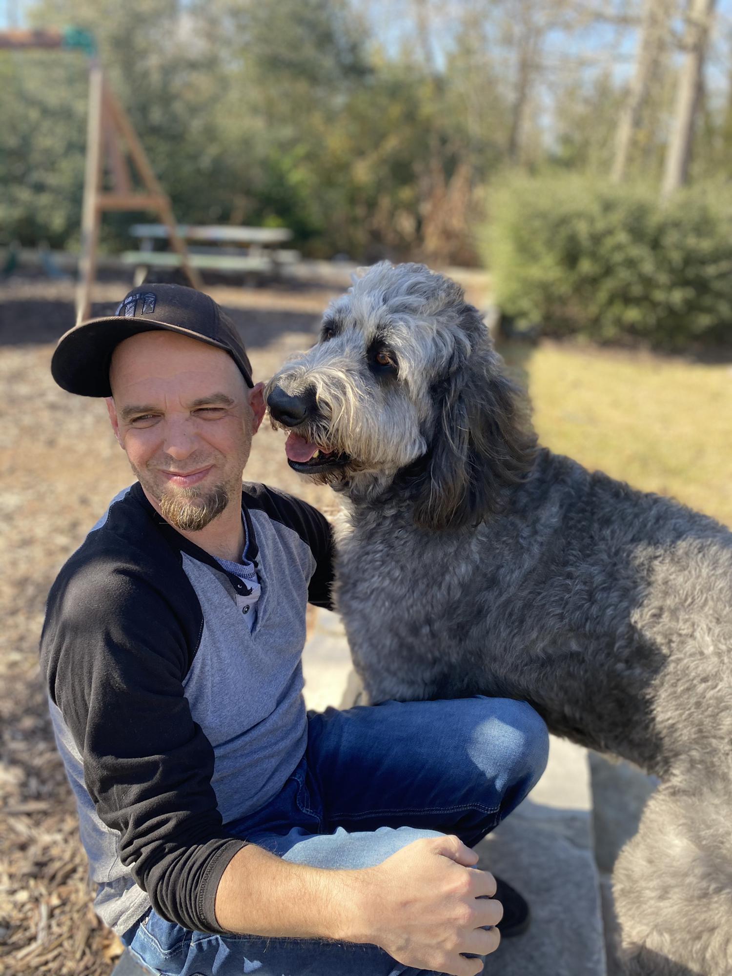 Jason loves dogs more than humans. This is his friend Doug.
