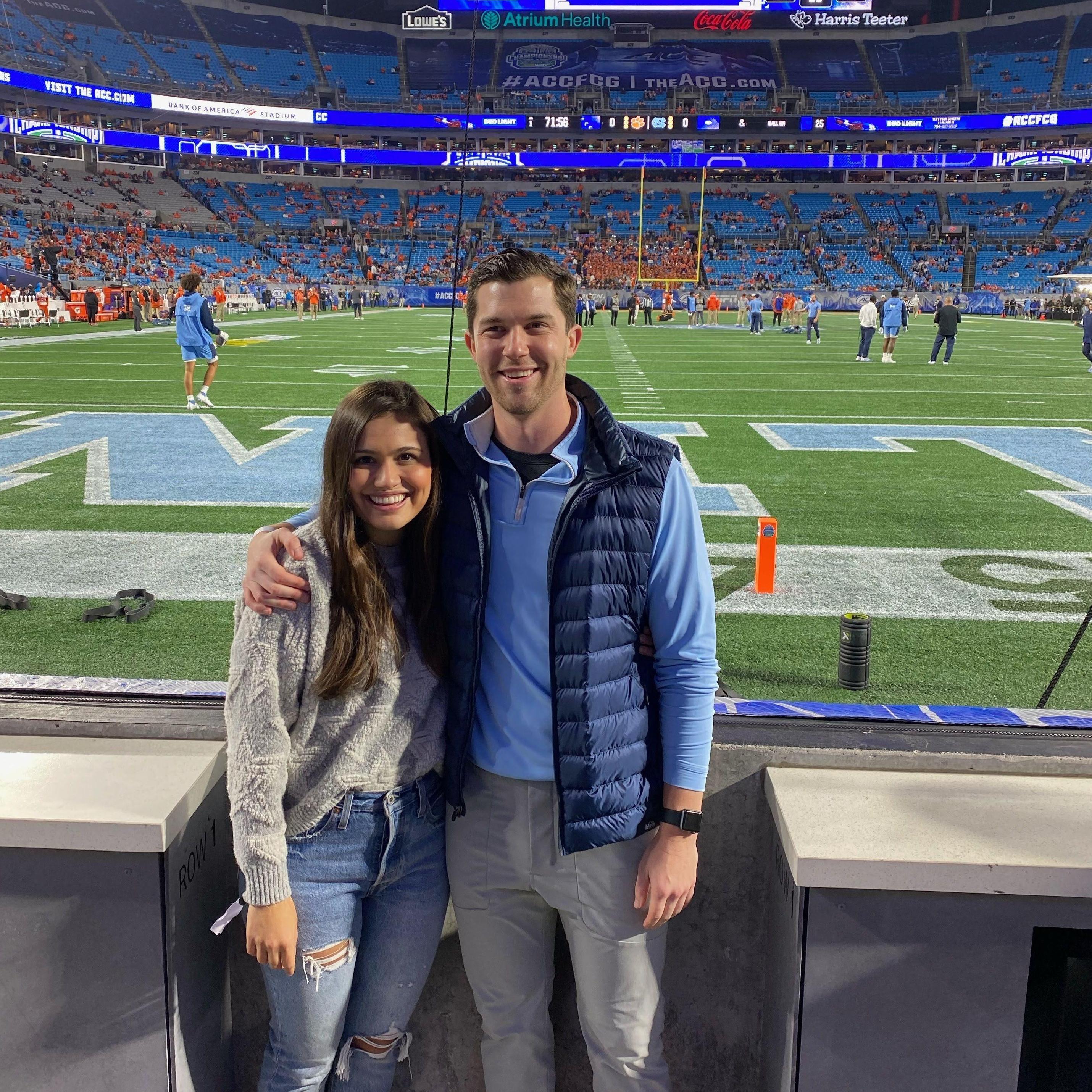 Brad loves going to football games - and Paige loves seeing Brad happy!