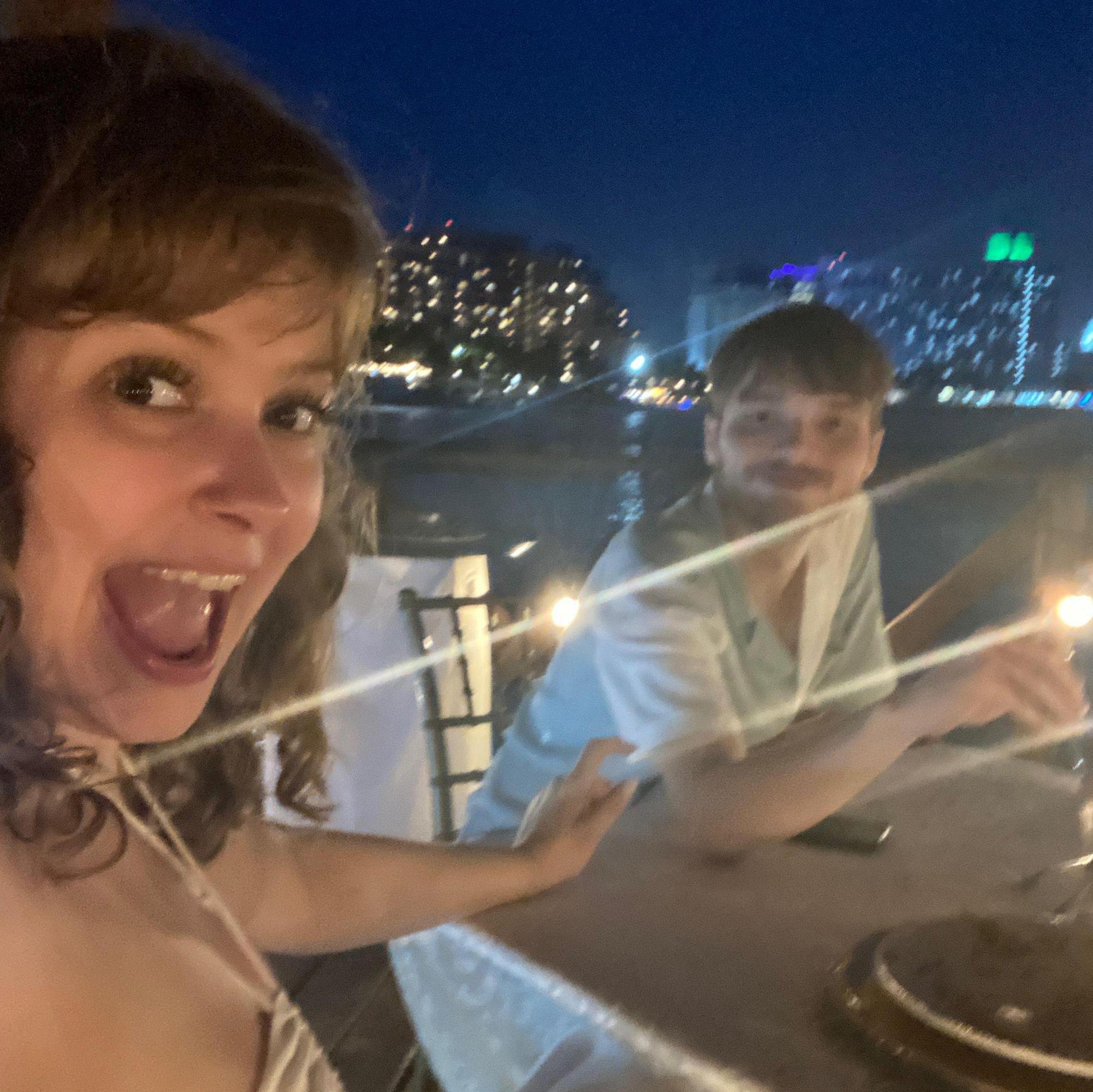 Photo of dinner in Cancun on a pier overlooking the ocean a few minutes before he proposed!