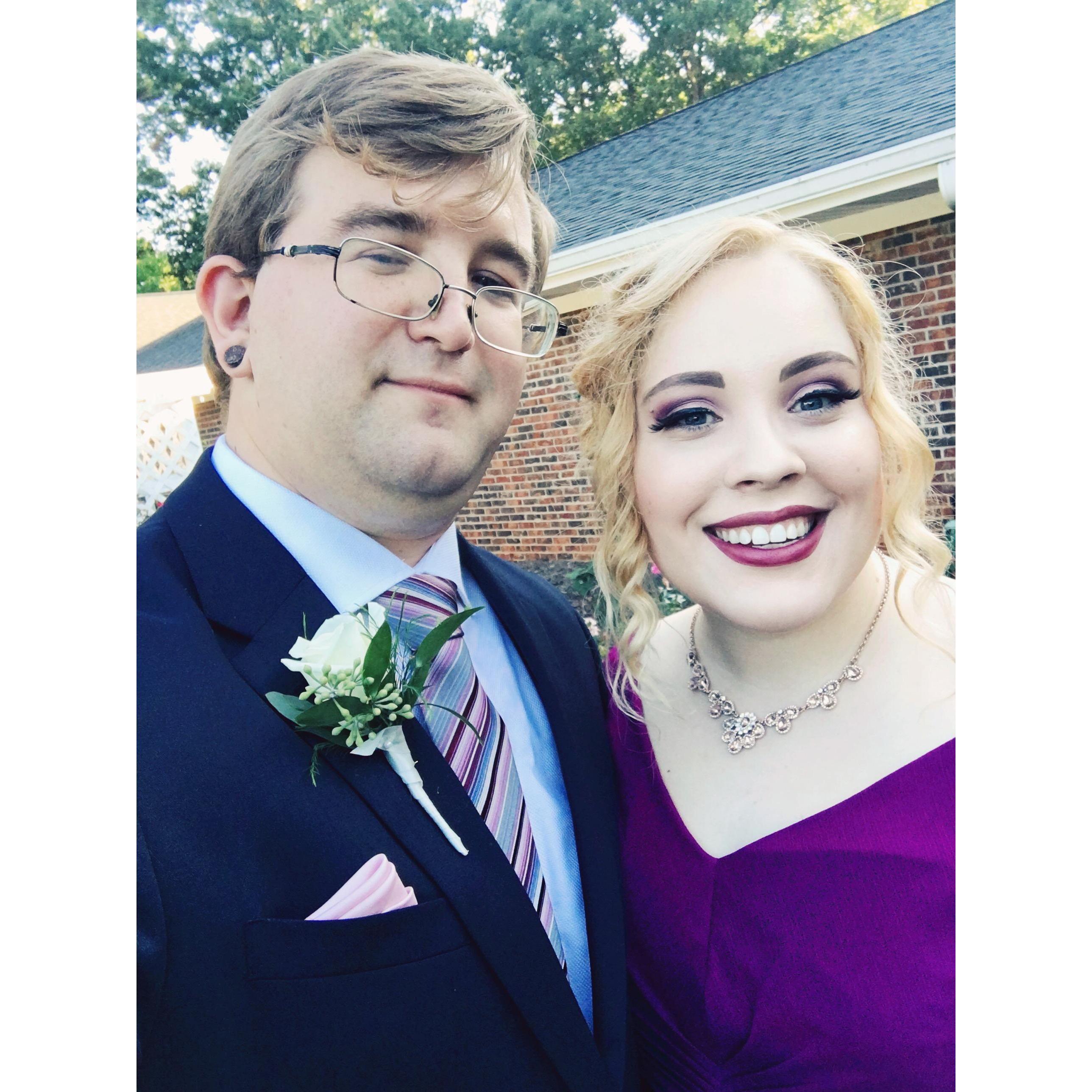 Both of us in our best friends wedding. We walked down the aisle there, and we will be doing it again soon.