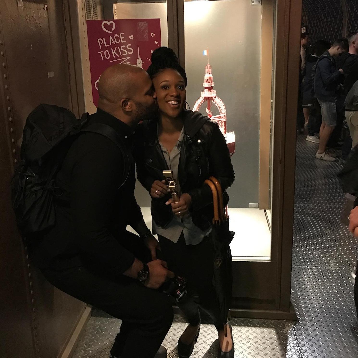 Sneaking in a kiss at the Eiffel Tower!