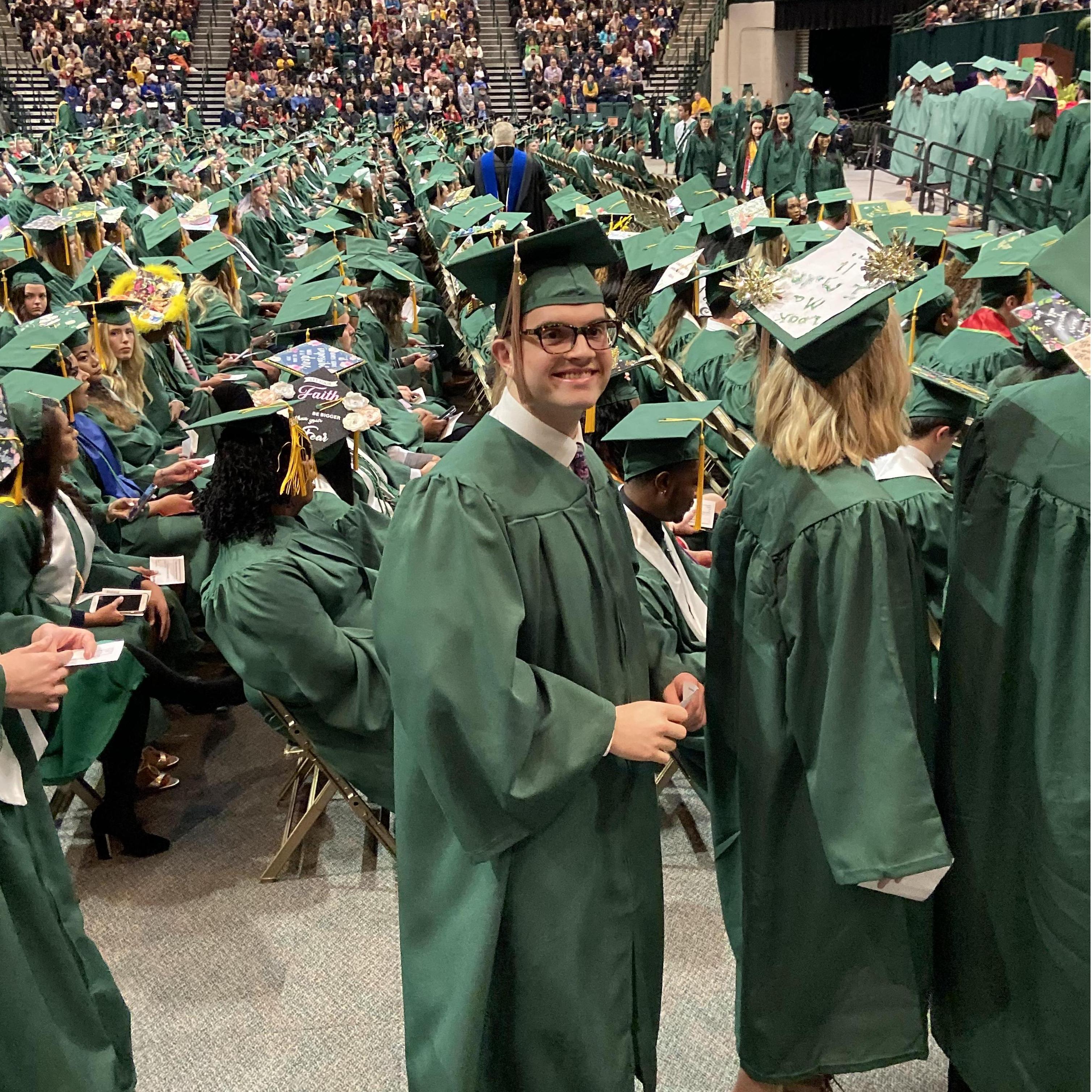 Walking up to snatch that diploma.