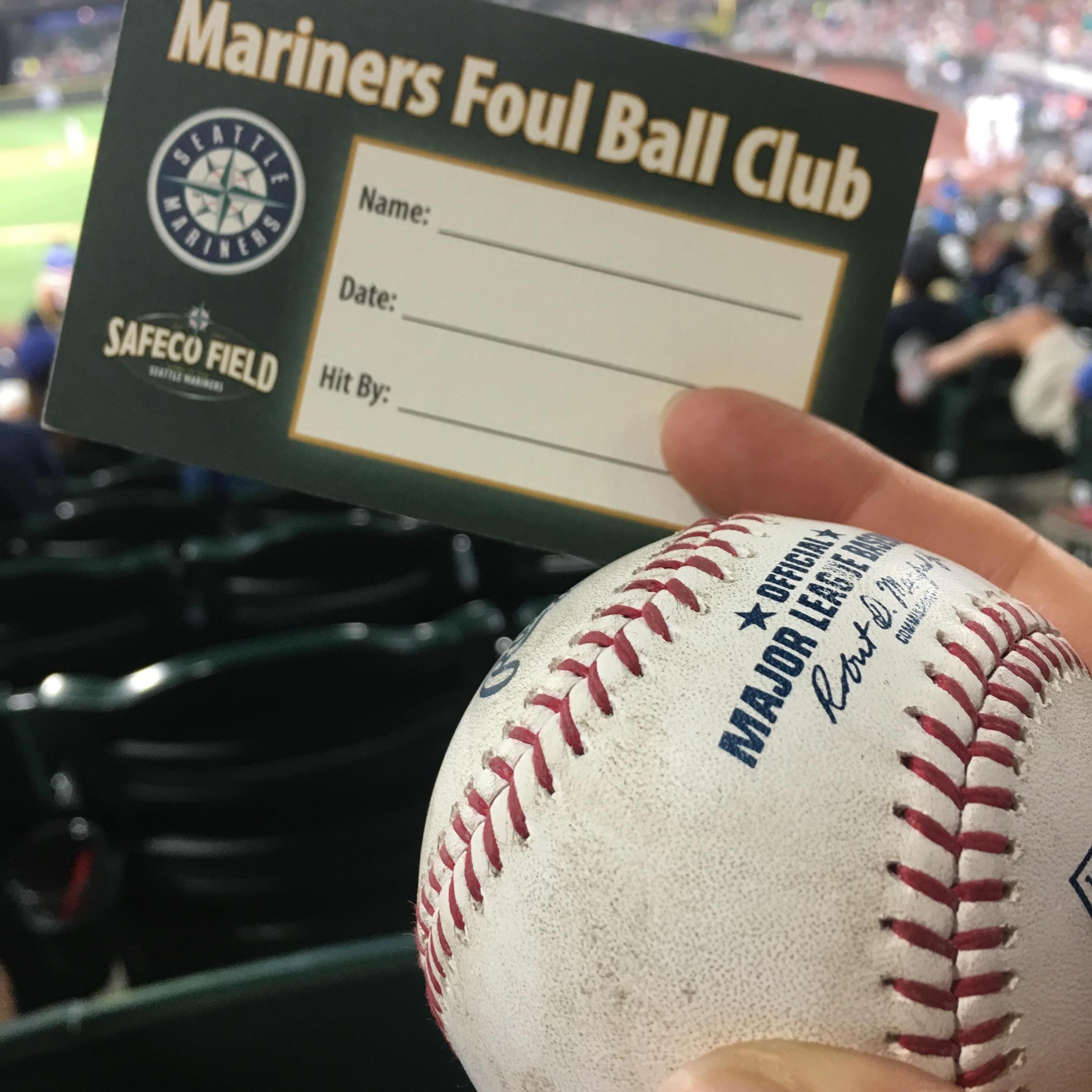 We closed on a house at a Mariners vs Twins game. Once we hung up the phone Craig caught this foul ball by a left handed twins player - bare handed.