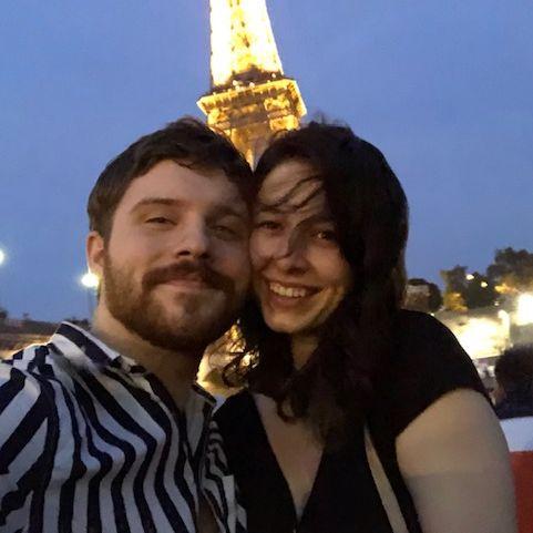 We love traveling. This is us hours off the plane on our first trip abroad together to France.