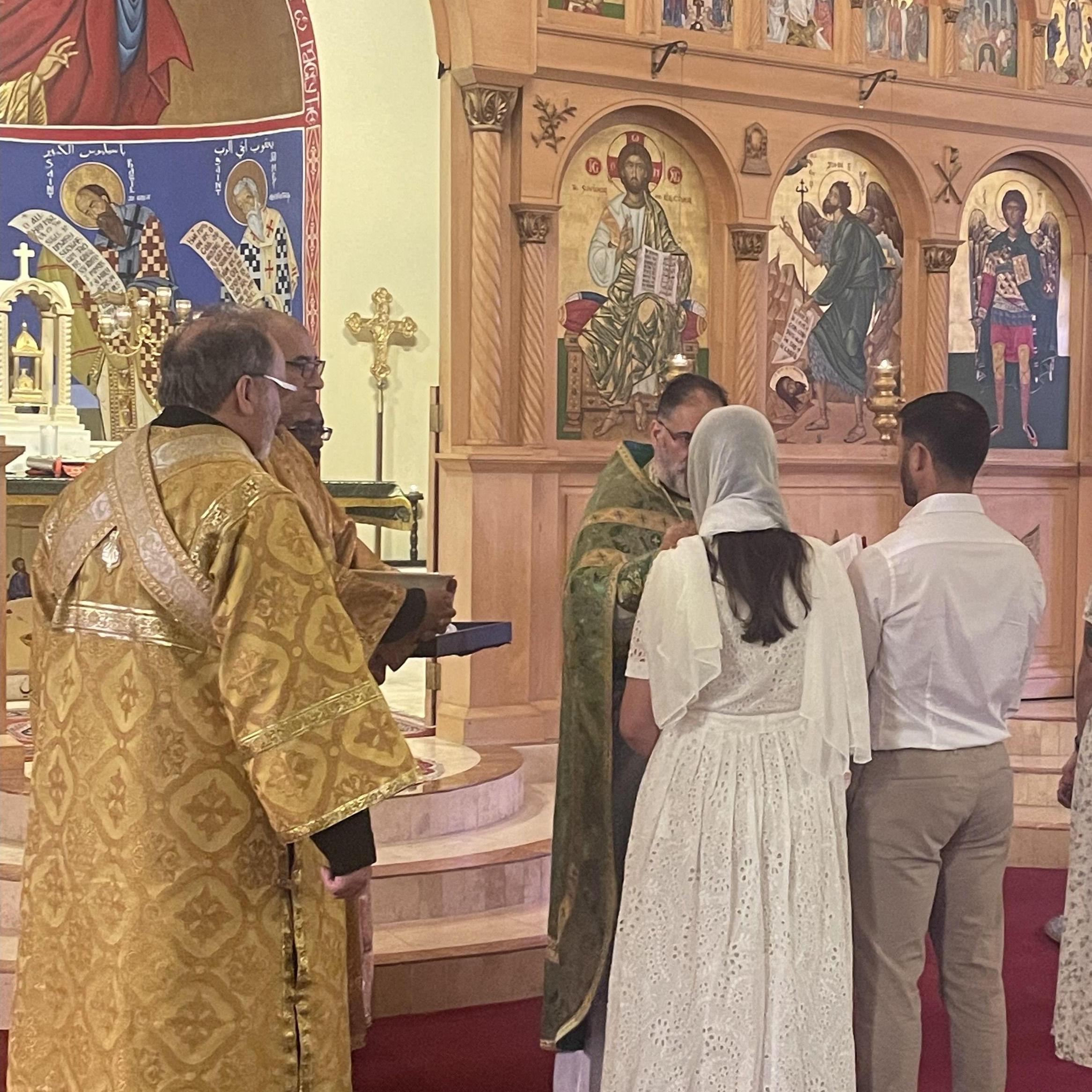 Us getting chrismated into the Orthodox Church. One of the happiest days of our lives!