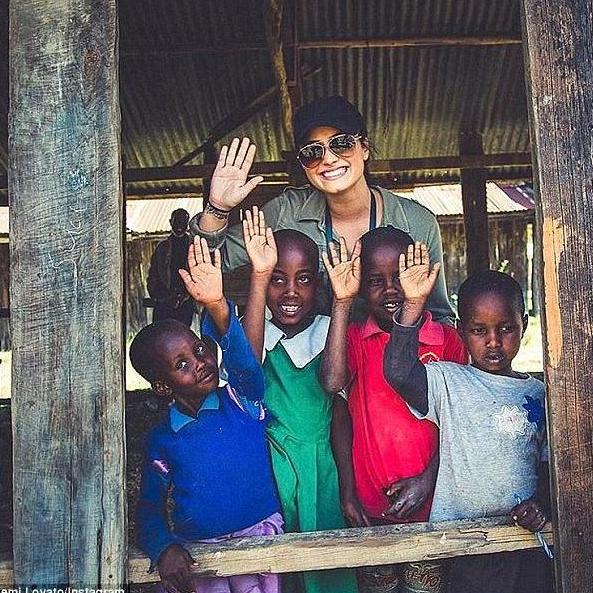 Alex bonding with children in Kenya thanks to her work with her fathers' charity.